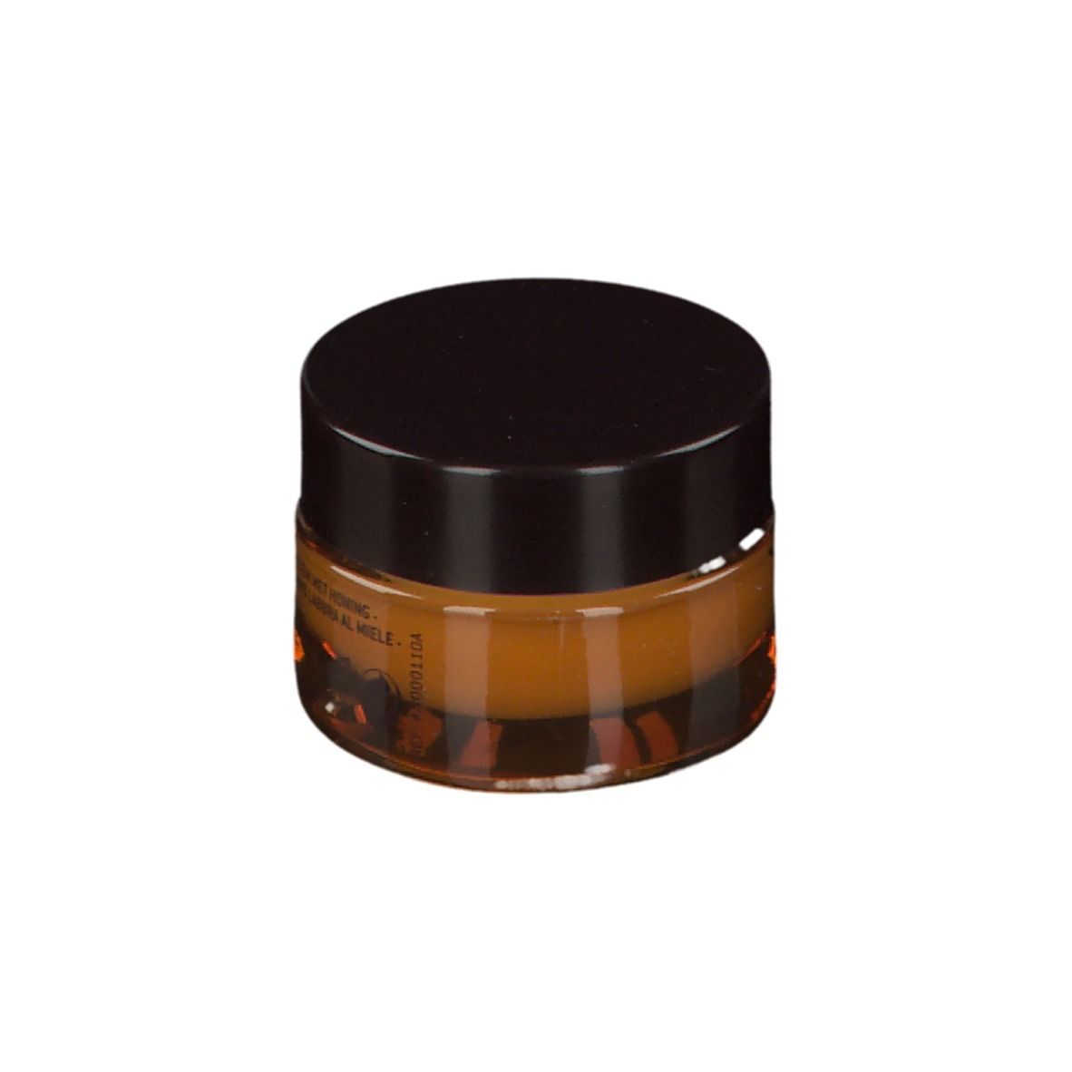 Vasetto rotondo con coperchio marrone. Balsamo color miele. Scritta: Codice data.