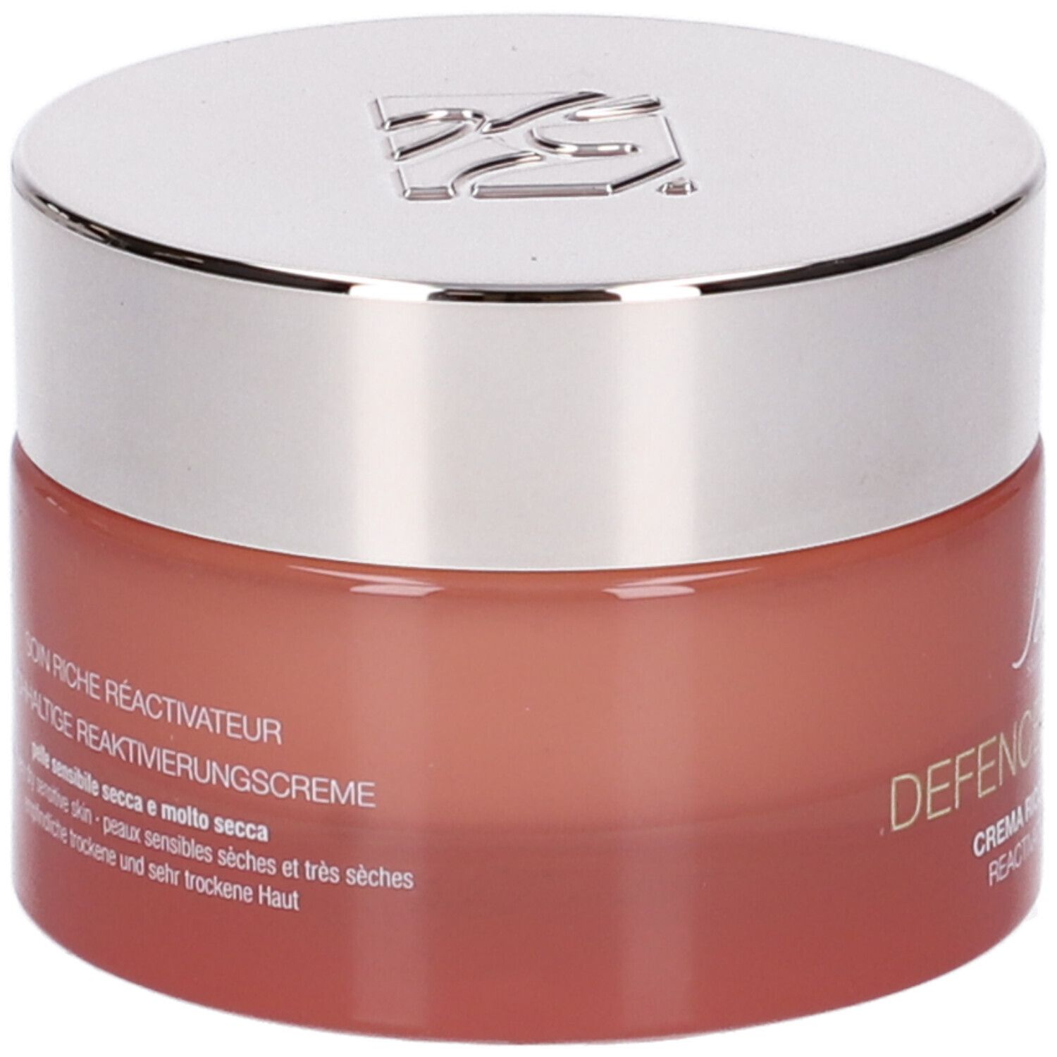 Vaso di crema con coperchio argentato. Scritta: Defence Skinergy, Soin Riche Réactivateur. Vaso rosso.