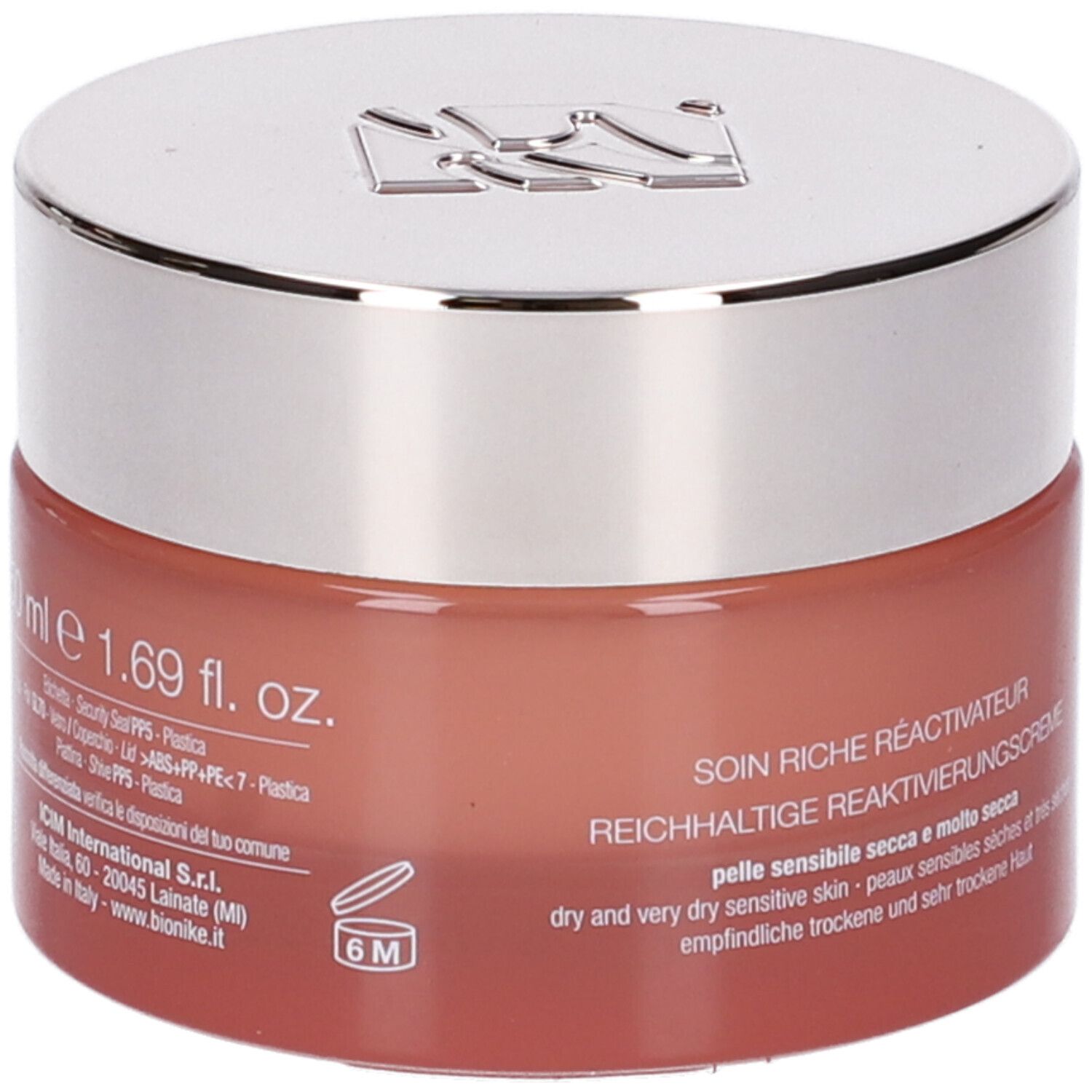 Vaso di crema con coperchio argentato. Scritta: Defence Skinergy, Soin Riche Réactivateur. Vaso rosso.