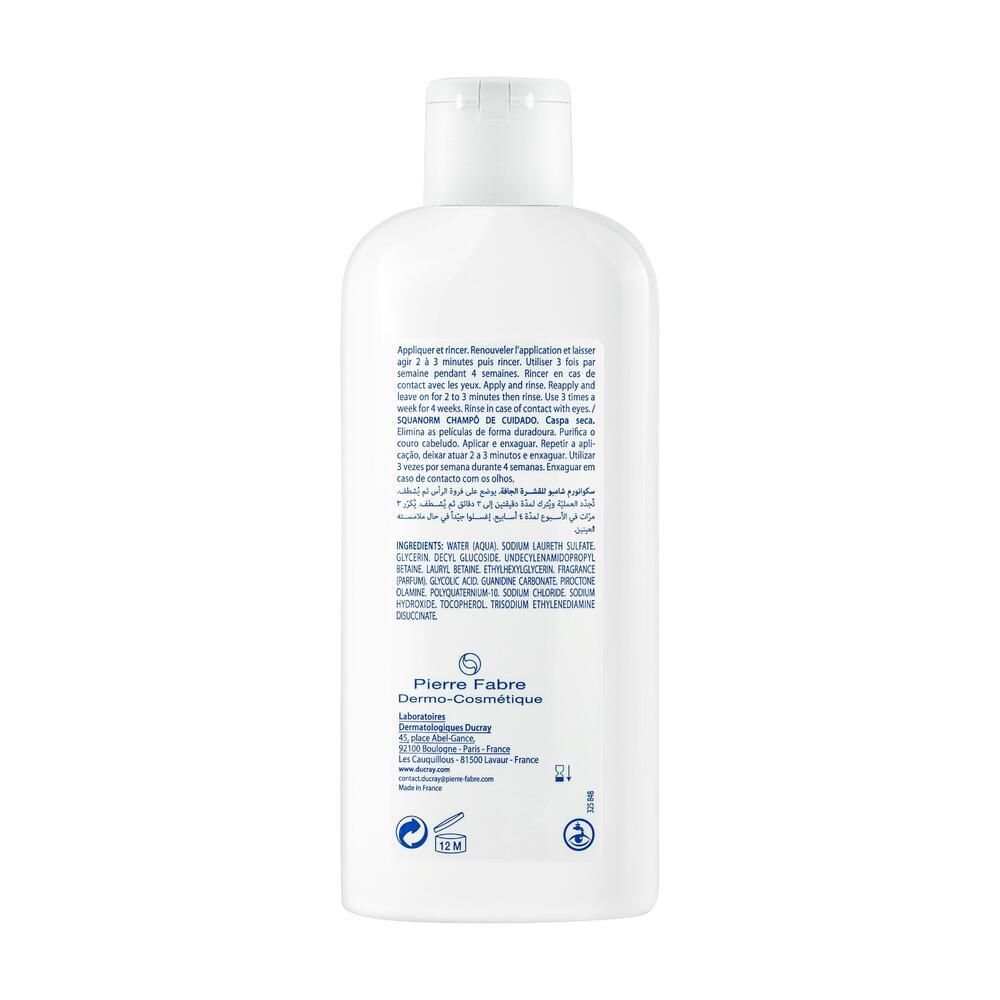 Dos du flacon de shampooing blanc. Texte : ingrédients, instructions d'utilisation, informations fabricant, logos.