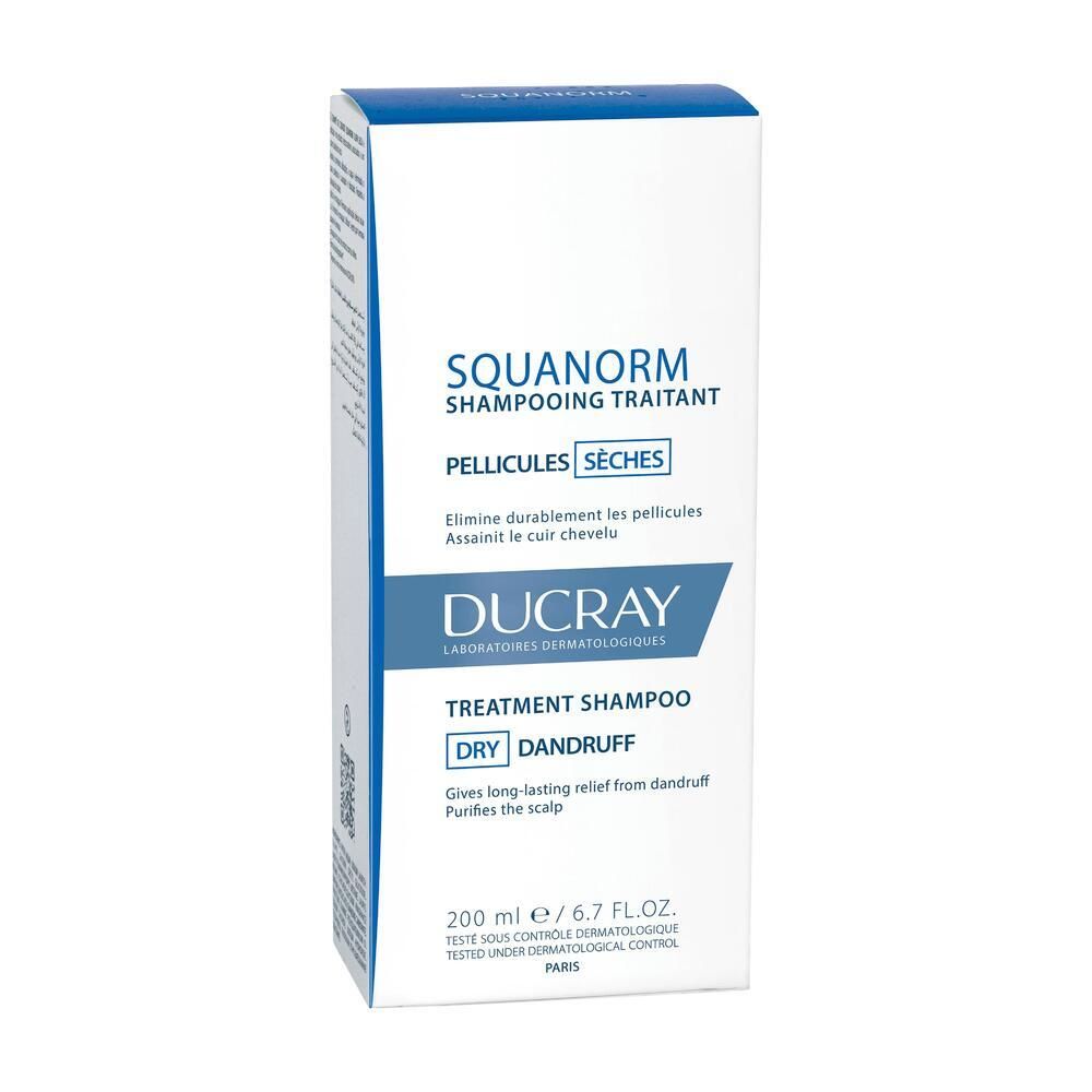 Boîte blanche avec couvercle bleu. Inscription : SQUANORM, DUCRAY, shampooing traitant, pellicules sèches. 200 ml.