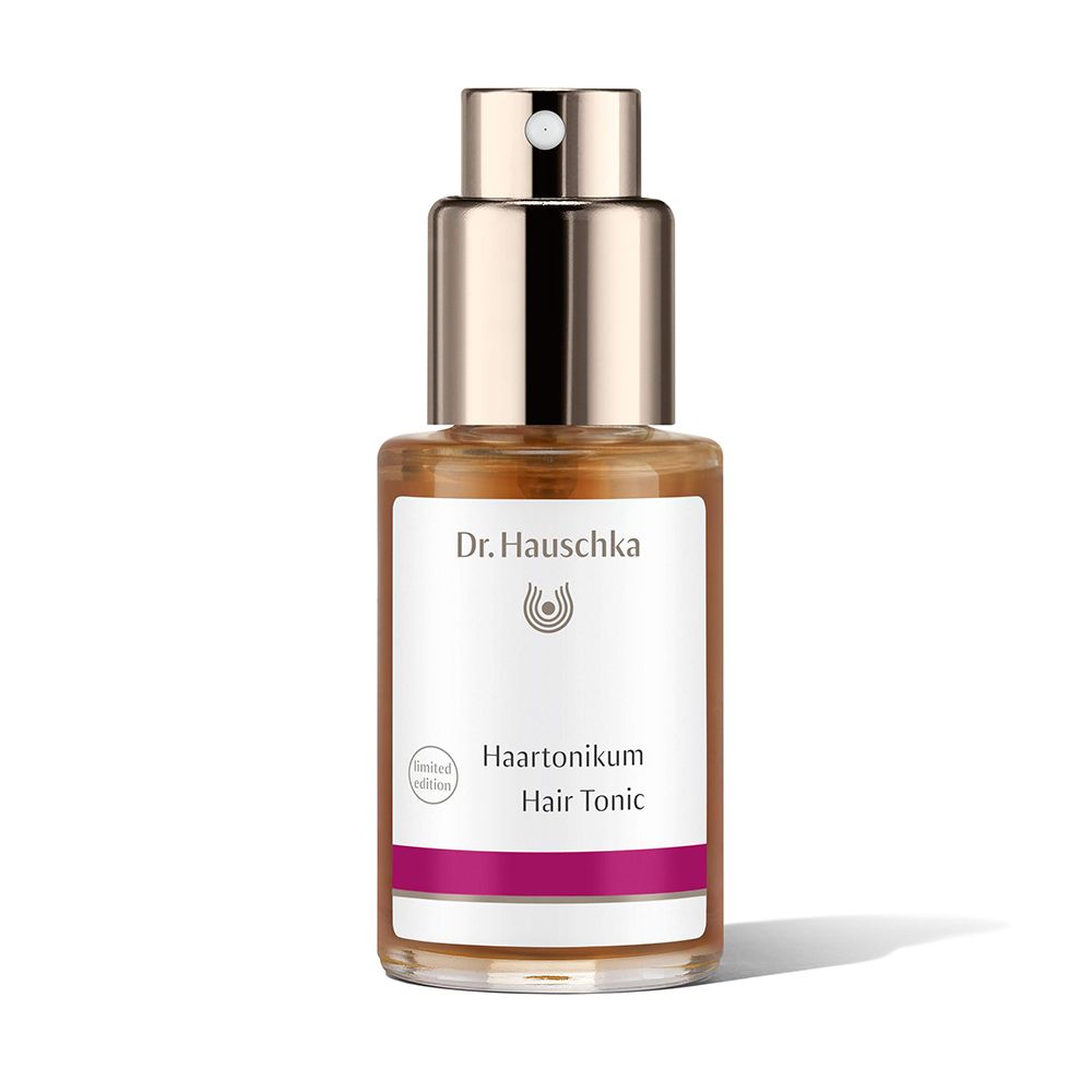 Flacone di vetro marrone con vaporizzatore. Etichetta con 'Haartonikum' e 'Hair Tonic'.