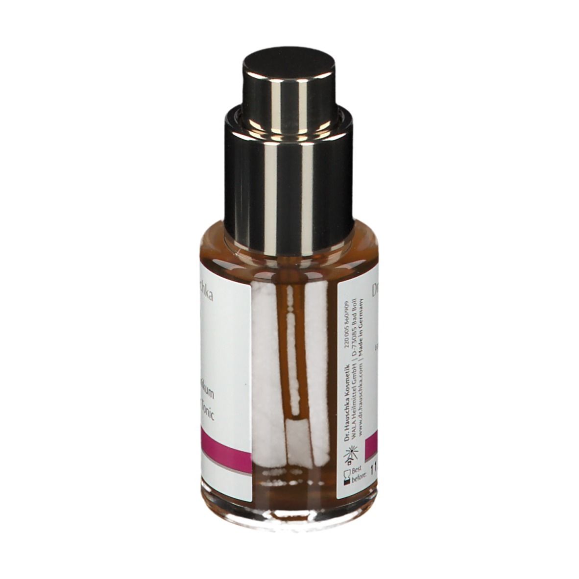Flacone di vetro marrone con vaporizzatore. Etichetta con 'Haartonikum' e 'Hair Tonic'.