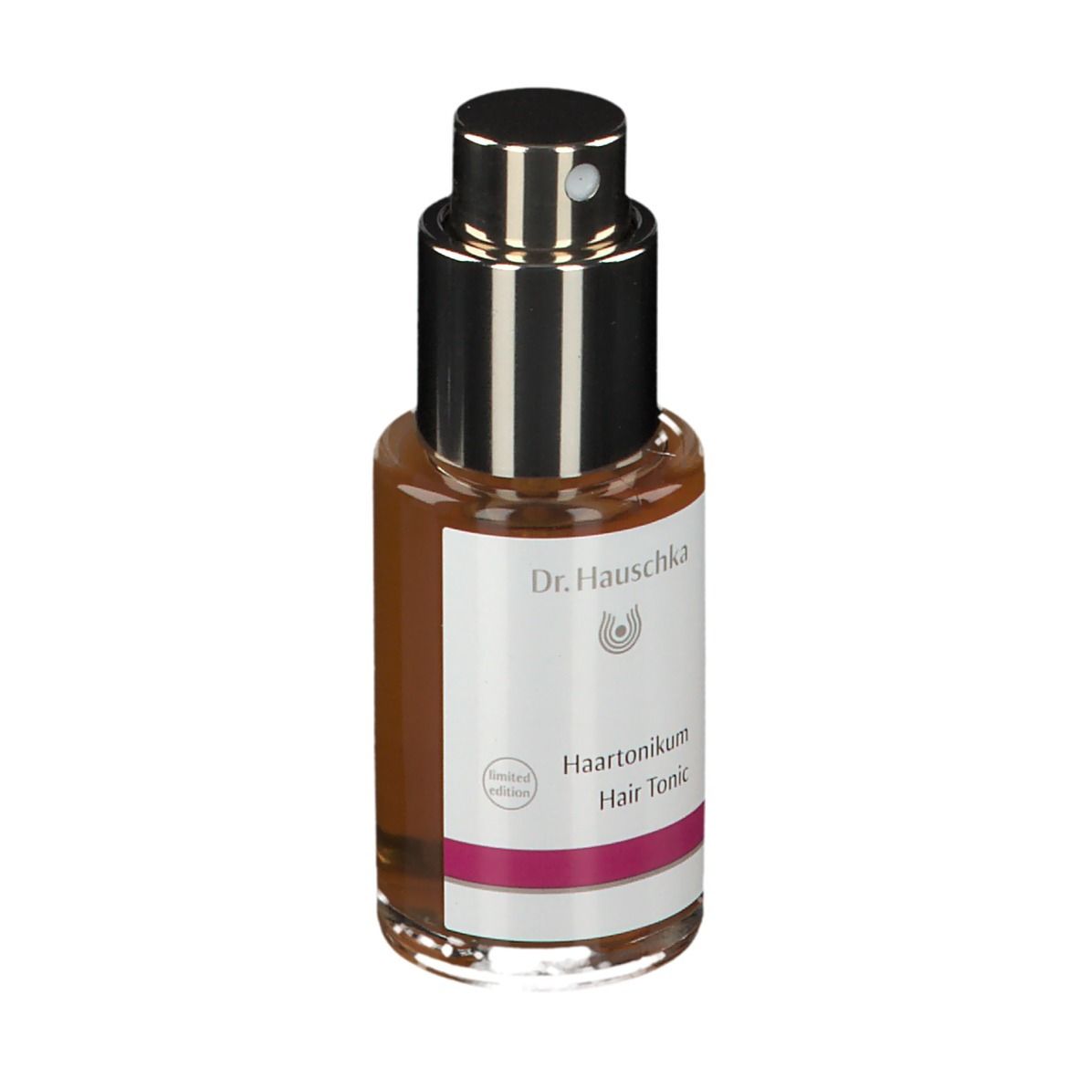 Flacone di vetro marrone con vaporizzatore. Etichetta con 'Haartonikum' e 'Hair Tonic'.