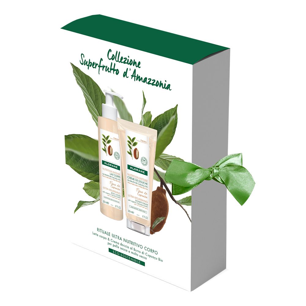 Geschenkbox mit zwei Produkten. Aufschrift: 'Collezione Superfrutto d'Amazzonia'. Grüne Schleife. Produkte von KLORANE.