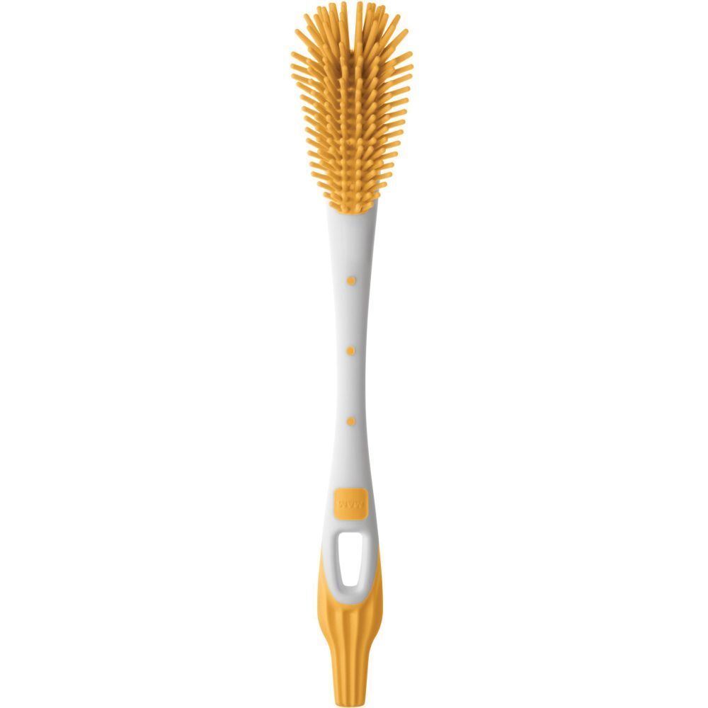 Testa della spazzola gialla con manico bianco e giallo. Il manico ha un'apertura ovale.