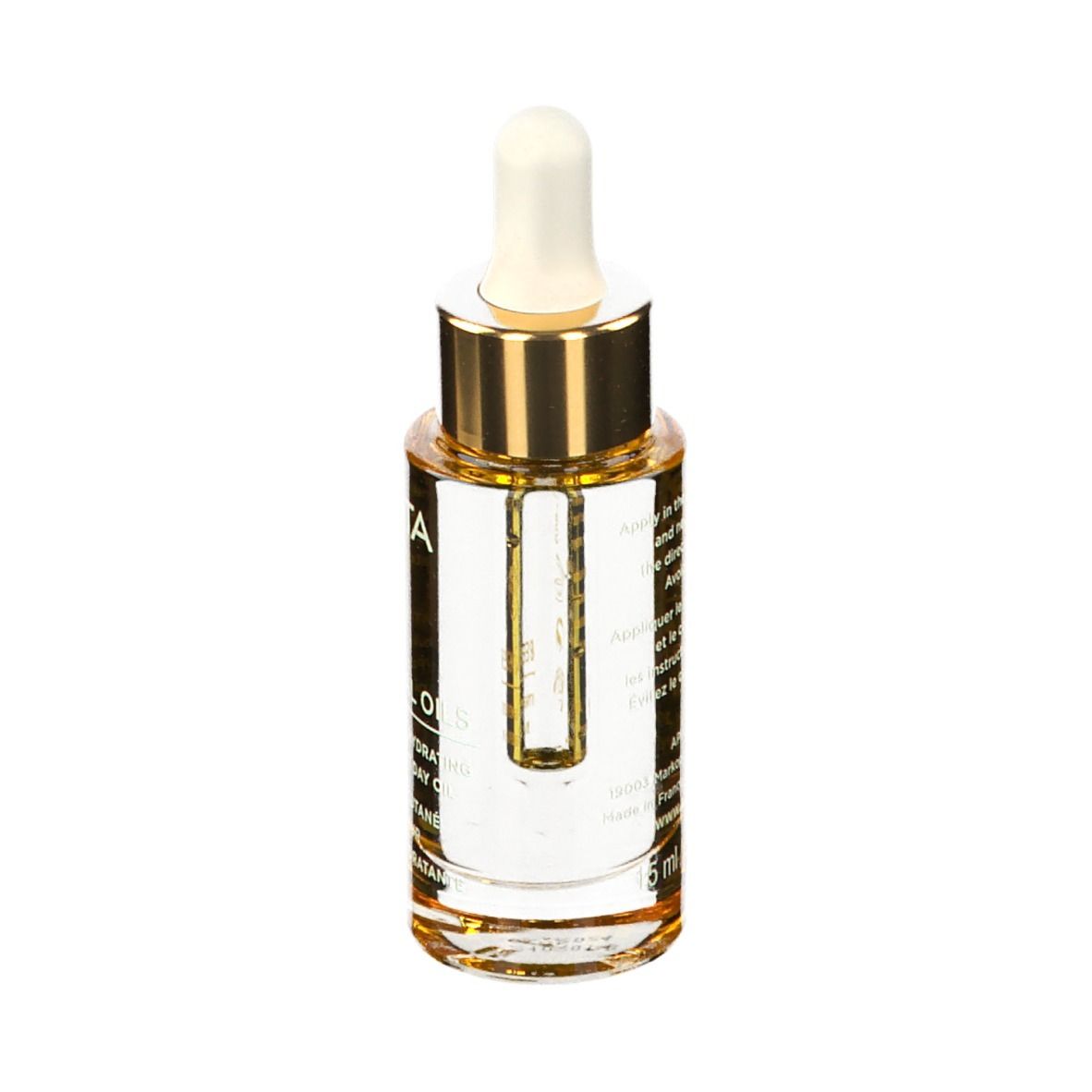 Flacone di olio con contagocce. Tappo dorato, punta bianca. Etichetta con testo.