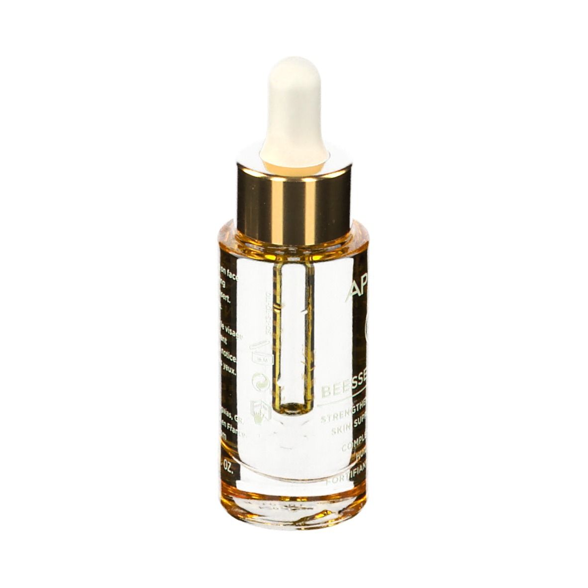 Flacone di olio con contagocce. Tappo dorato, punta bianca. Etichetta con testo.