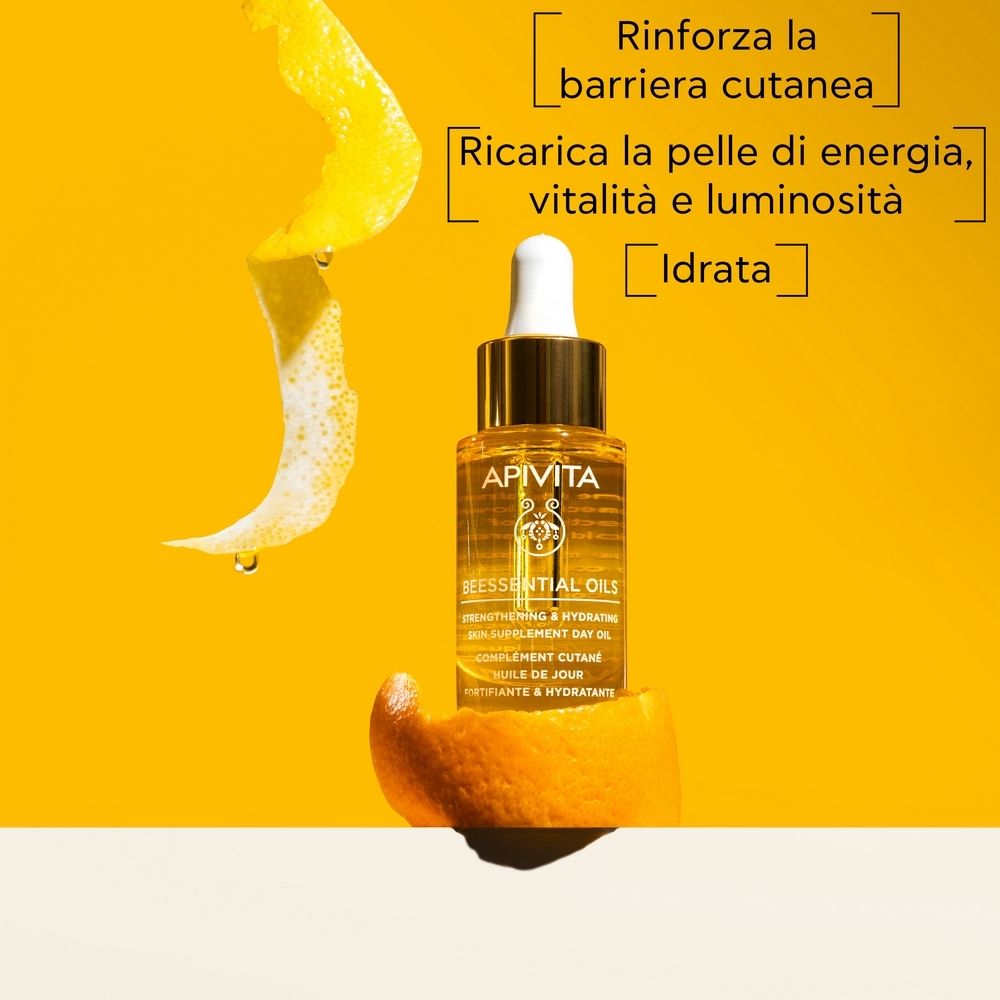 Flacone di olio con contagocce, circondato da scorze di limone. Testo: Rinfroza la barriera cutanea, Ricarica la pelle.