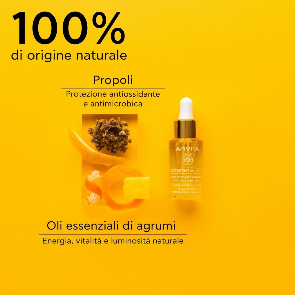 Flacone di olio con contagocce, accanto a propoli e agrumi. Testo: 100% di origine naturale, Oli essenziali di agrumi.