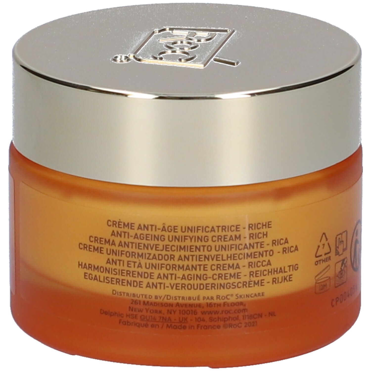 Vasetto di crema arancione con coperchio argentato. Retro con testo in più lingue. Marchio Roc.
