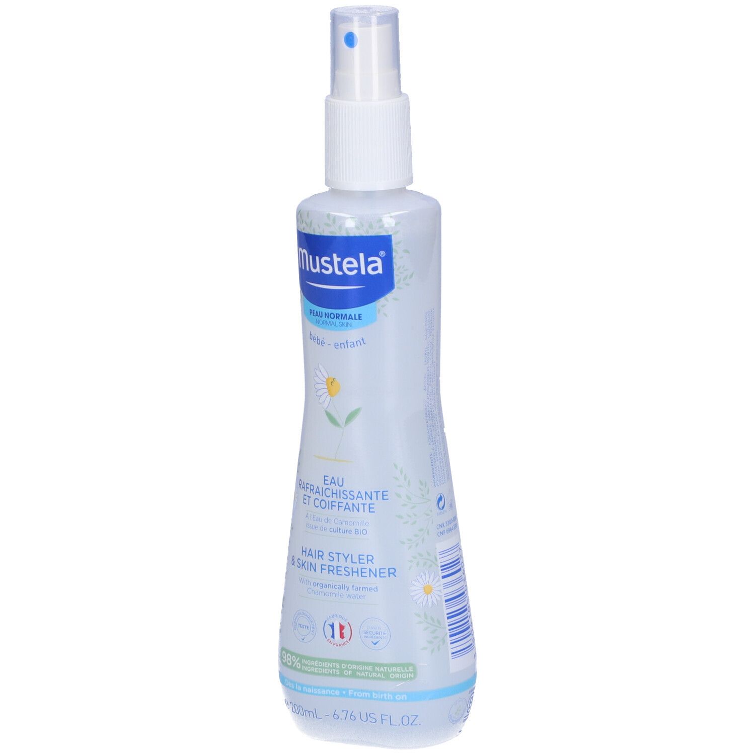 Mustela Haare Erfrischer und Styling Wasser in einer Sprühflasche.