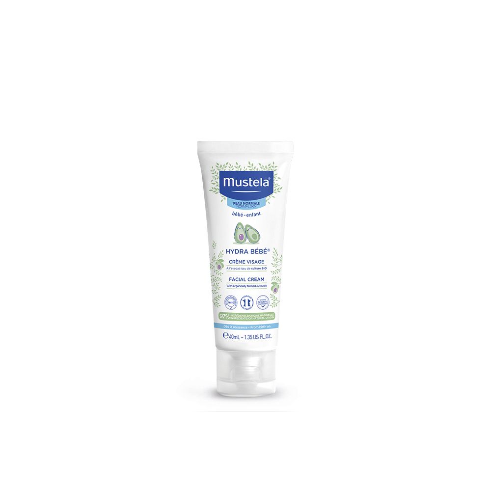 Creme-Tube mit blauem Deckel. Aufschrift Mustela, Hydra Bébé, Crème Visage. Enthält Avocado-Extrakt.