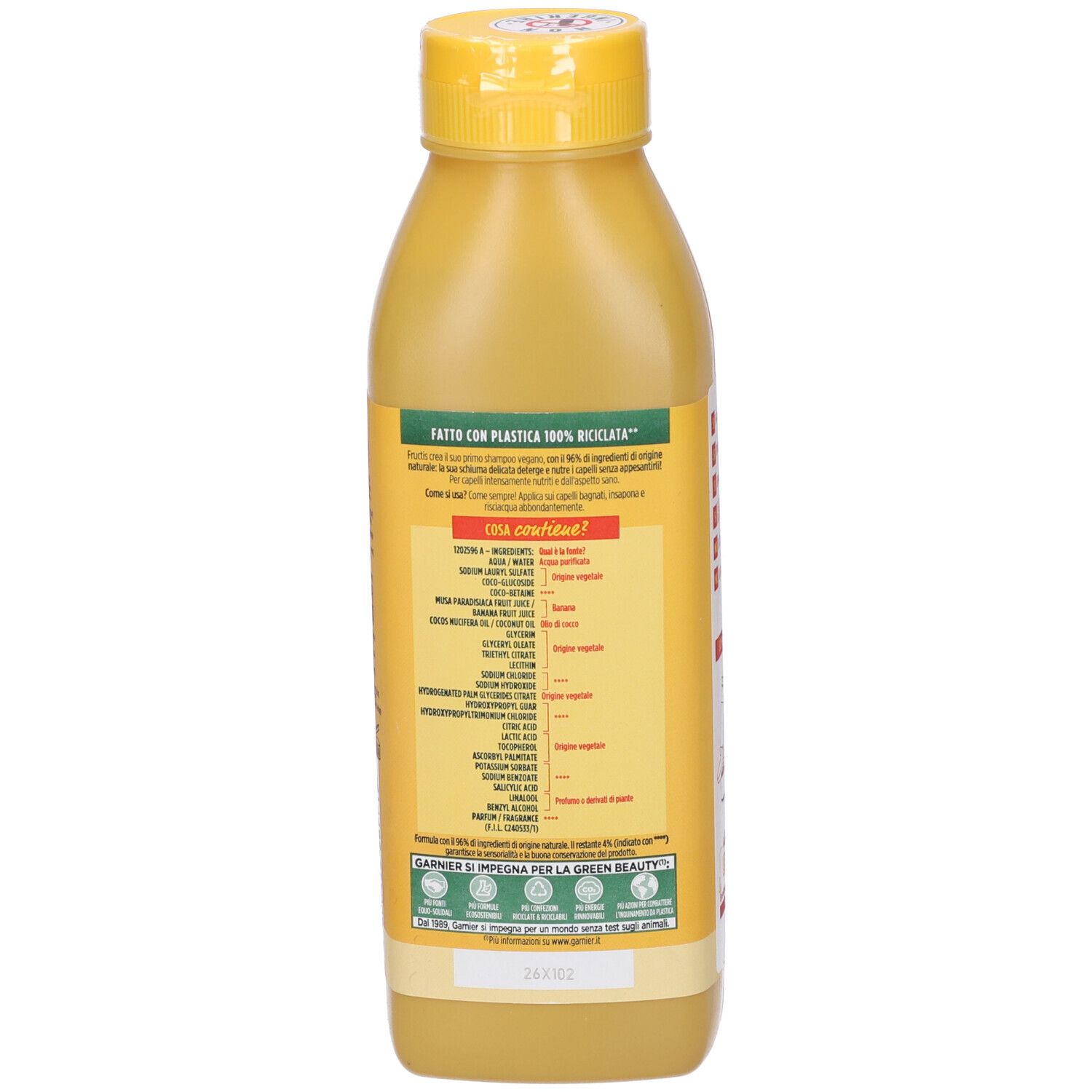 Retro del flacone di shampoo giallo. Scritta: Garnier Fructis. Informazioni sugli ingredienti e il riciclo.