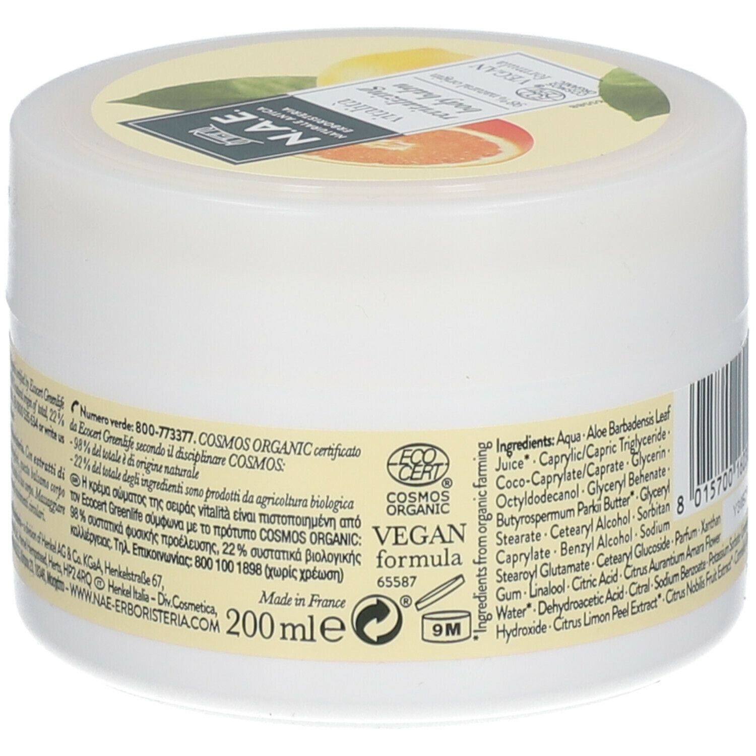 Vasetto bianco con etichetta giallo-arancio. Scritta: N.A.E. vitalità revitalizing body balm. Formula vegana. Certificazione Cosmos Organic.
