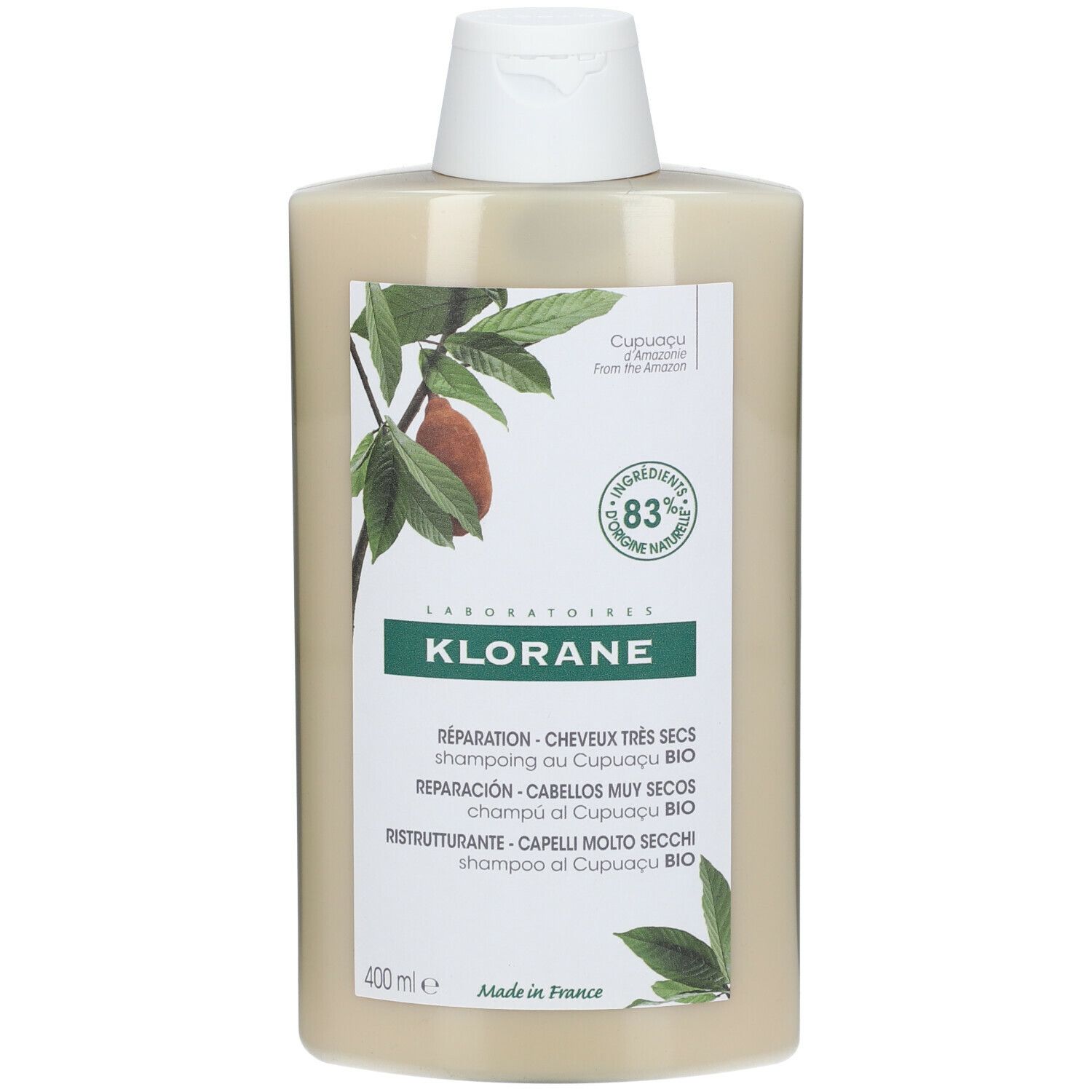 Flacone di shampoo beige con tappo bianco. Scritta KLORANE, testo e illustrazioni di foglie e frutti.