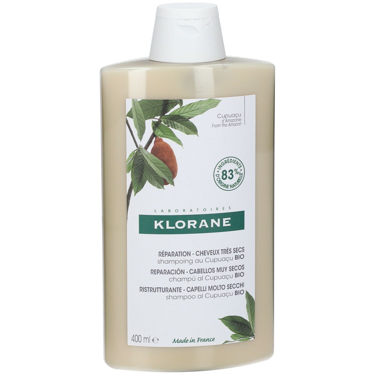 Flacone di shampoo beige con tappo bianco. Scritta KLORANE, testo e illustrazioni di foglie e frutti.