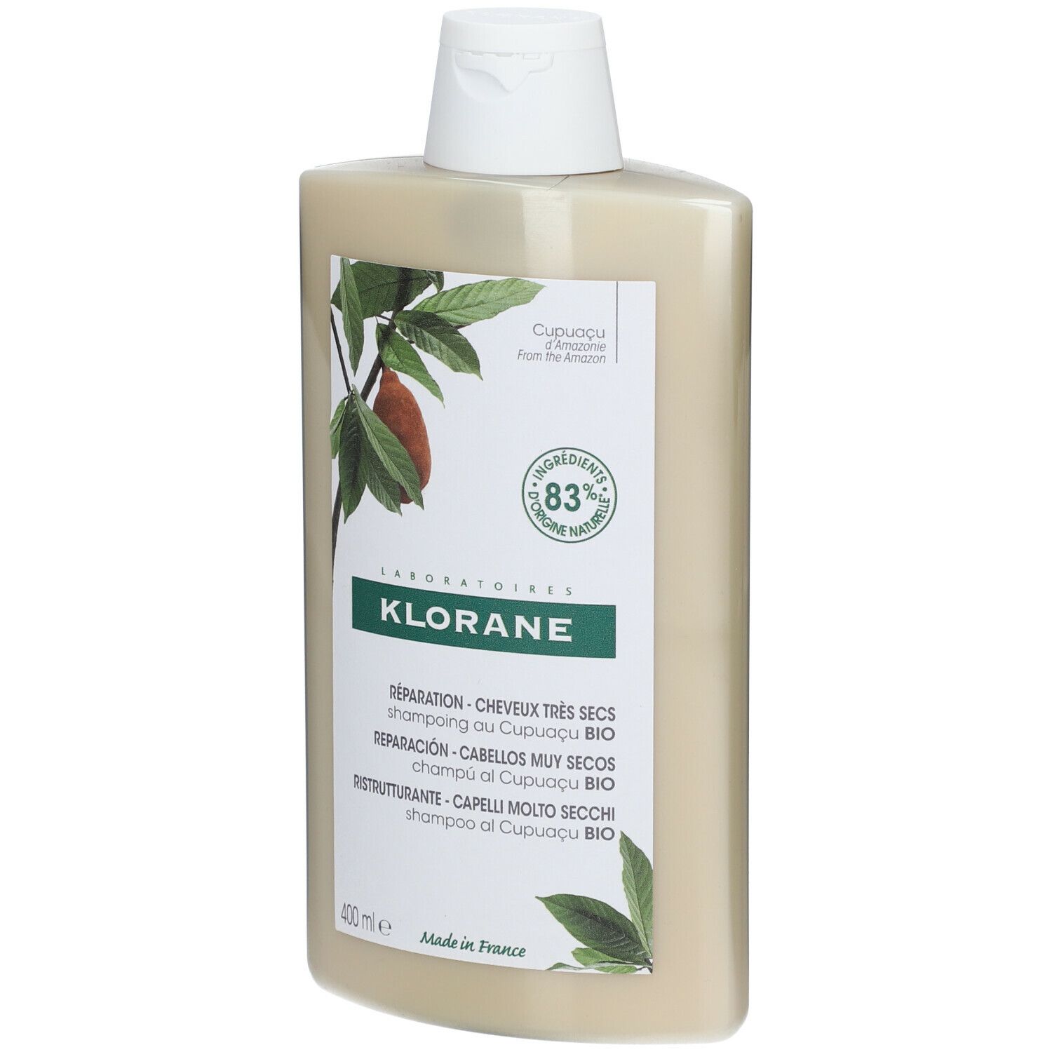 Flacone di shampoo beige con tappo bianco. Scritta KLORANE, testo e illustrazioni di foglie e frutti.