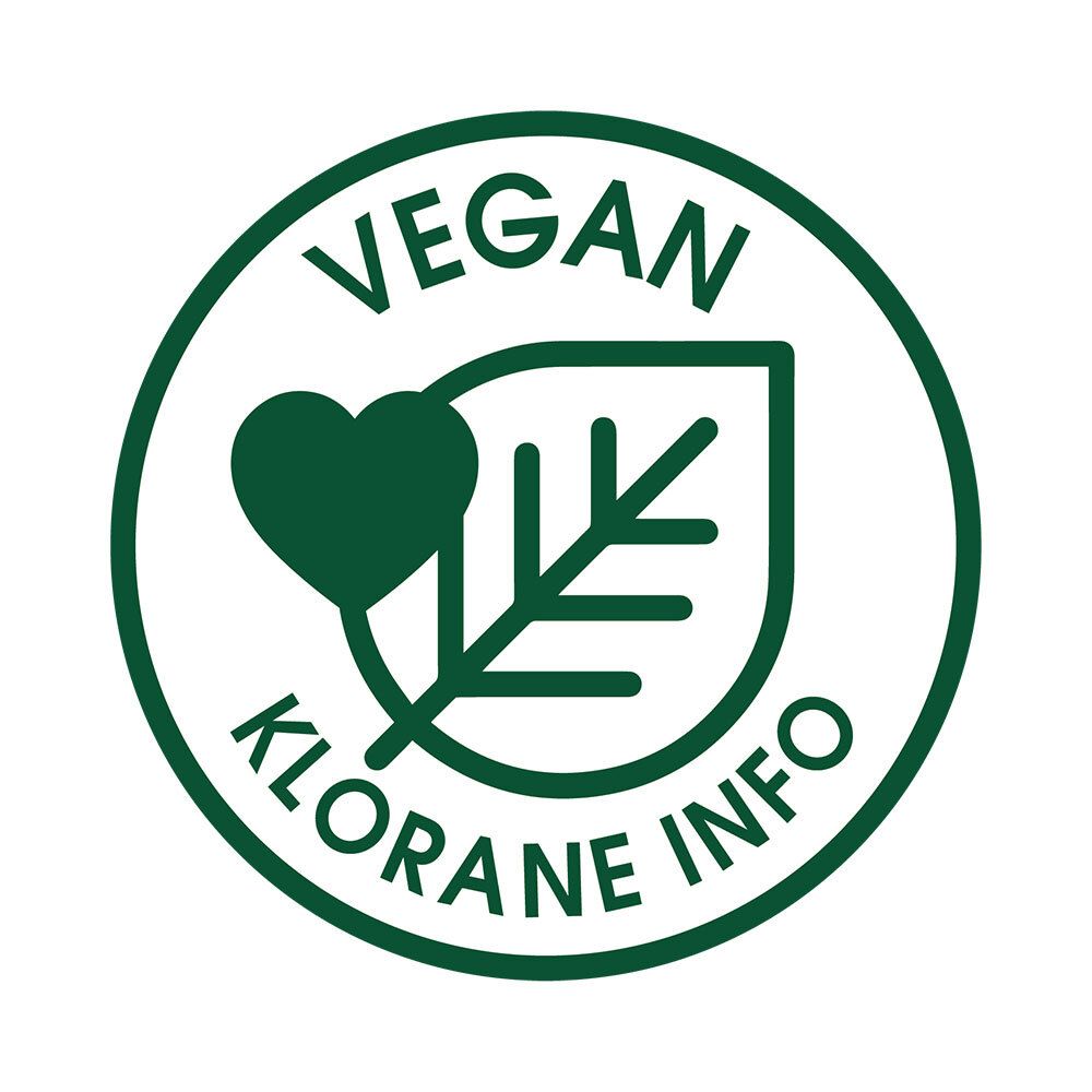 Adesivo rotondo con bordo verde e testo 'VEGAN Klorane INFO'. Contiene un cuore e una foglia.