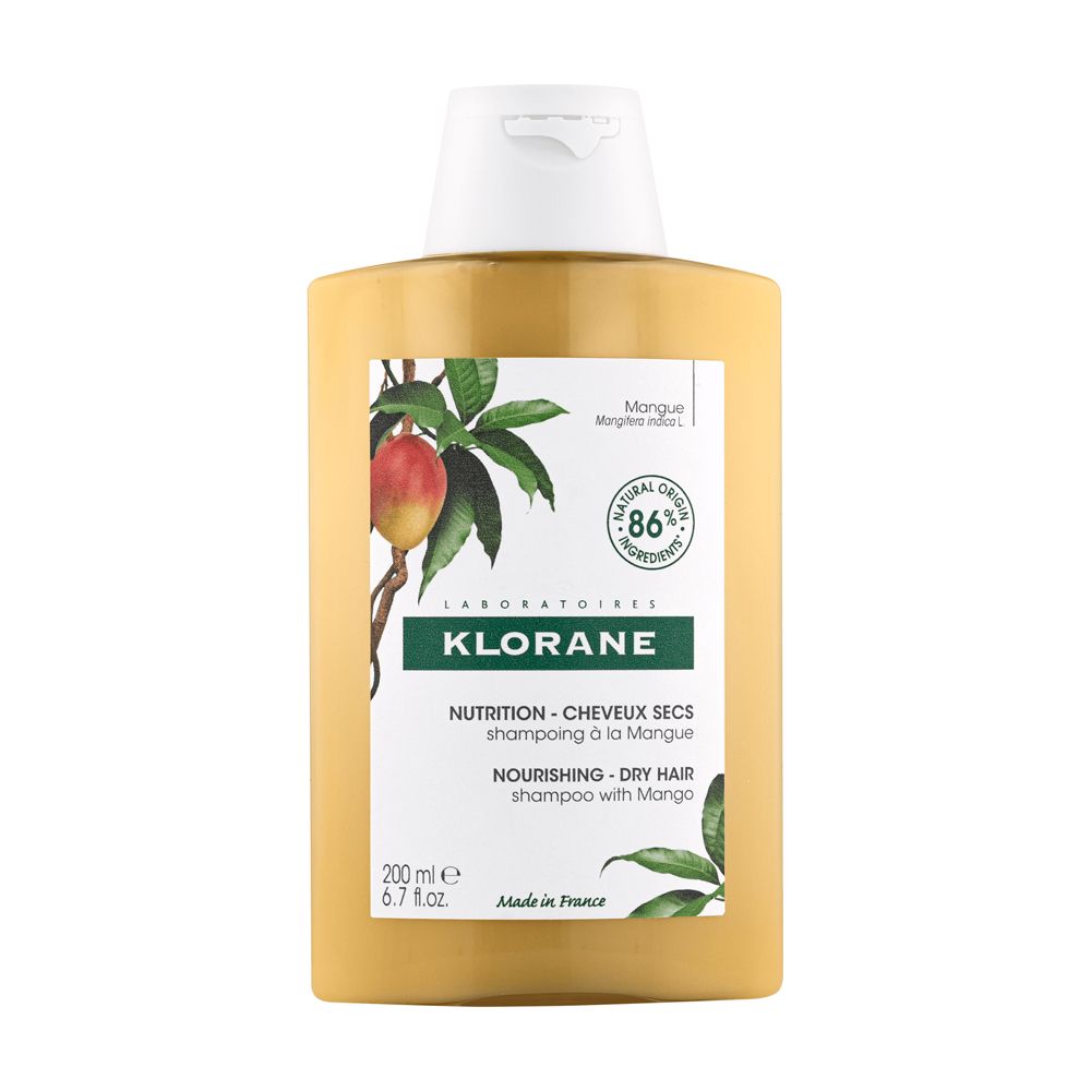 Flacon jaune avec bouchon blanc. Étiquette avec illustration de mangue et texte: KLORANE, Shampooing, 86% ingrédients naturels.