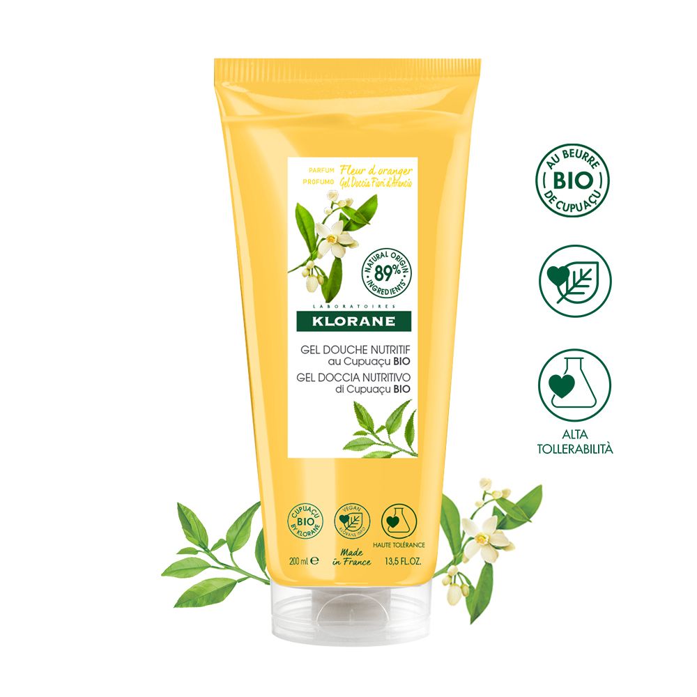 Tubo giallo. Klorane Gel Douche Nutritif. Scritta: Fiore d'Arancio, Cupuaçu BIO. Certificazioni: 89% ingredienti naturali, alta tollerabilità.