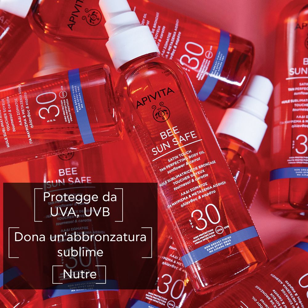 Diverse bottiglie di olio APIVITA Bee Sun Safe. Liquido rosso. SPF 30. Testo: Protegge da UVA, UVB. Abbronzatura.