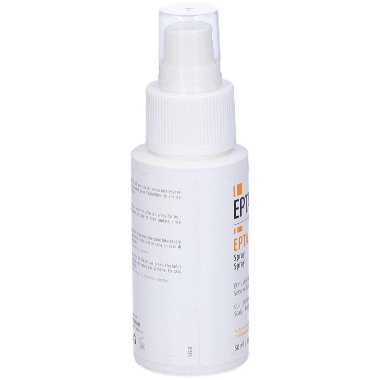 Retro del flacone spray bianco. Testo: Istruzioni per l'uso multilingue. Prodotto in Svizzera.