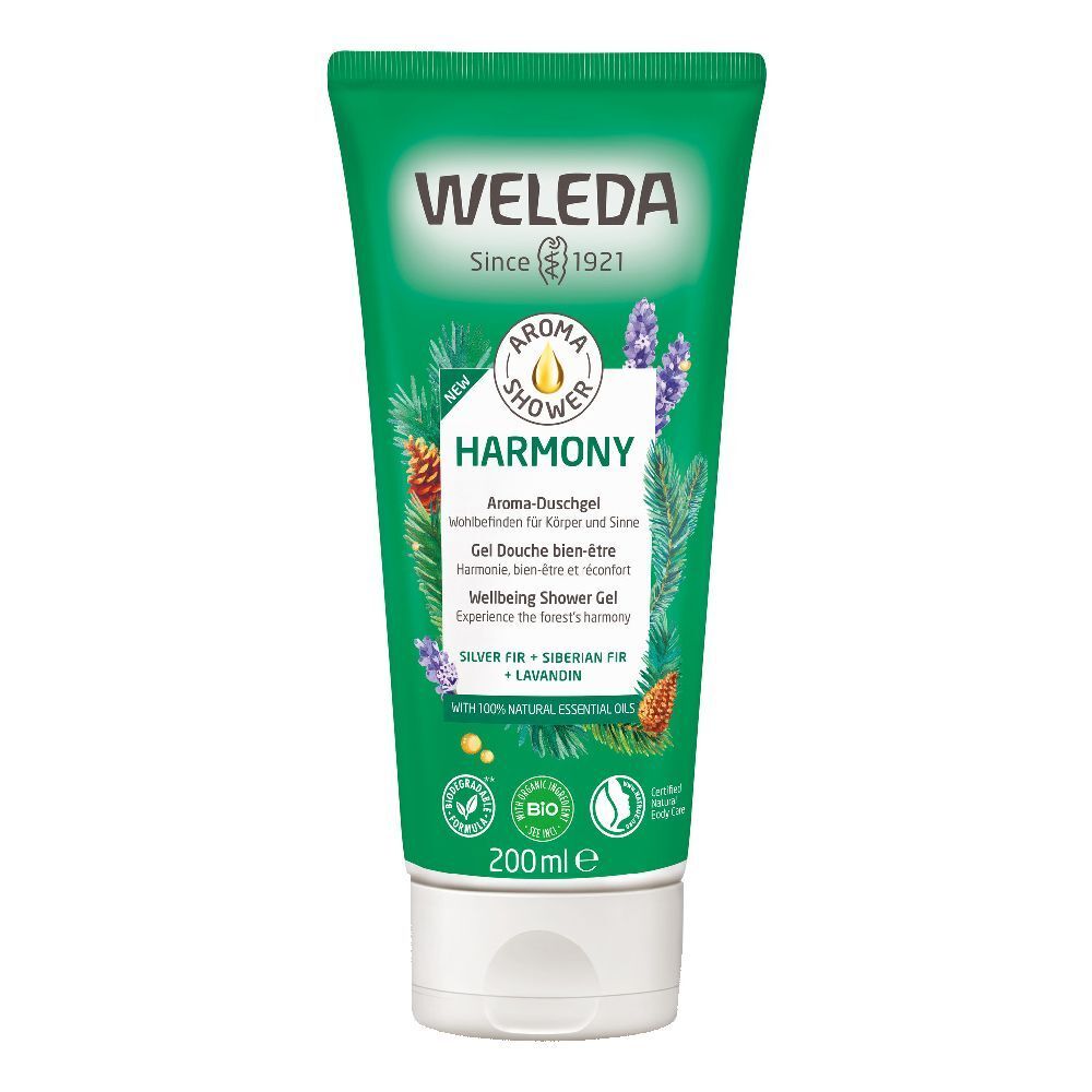 Tubo verde con tappo bianco. Scritta: WELEDA Aroma Shower Harmony. Contiene oli essenziali. Certificazione bio.