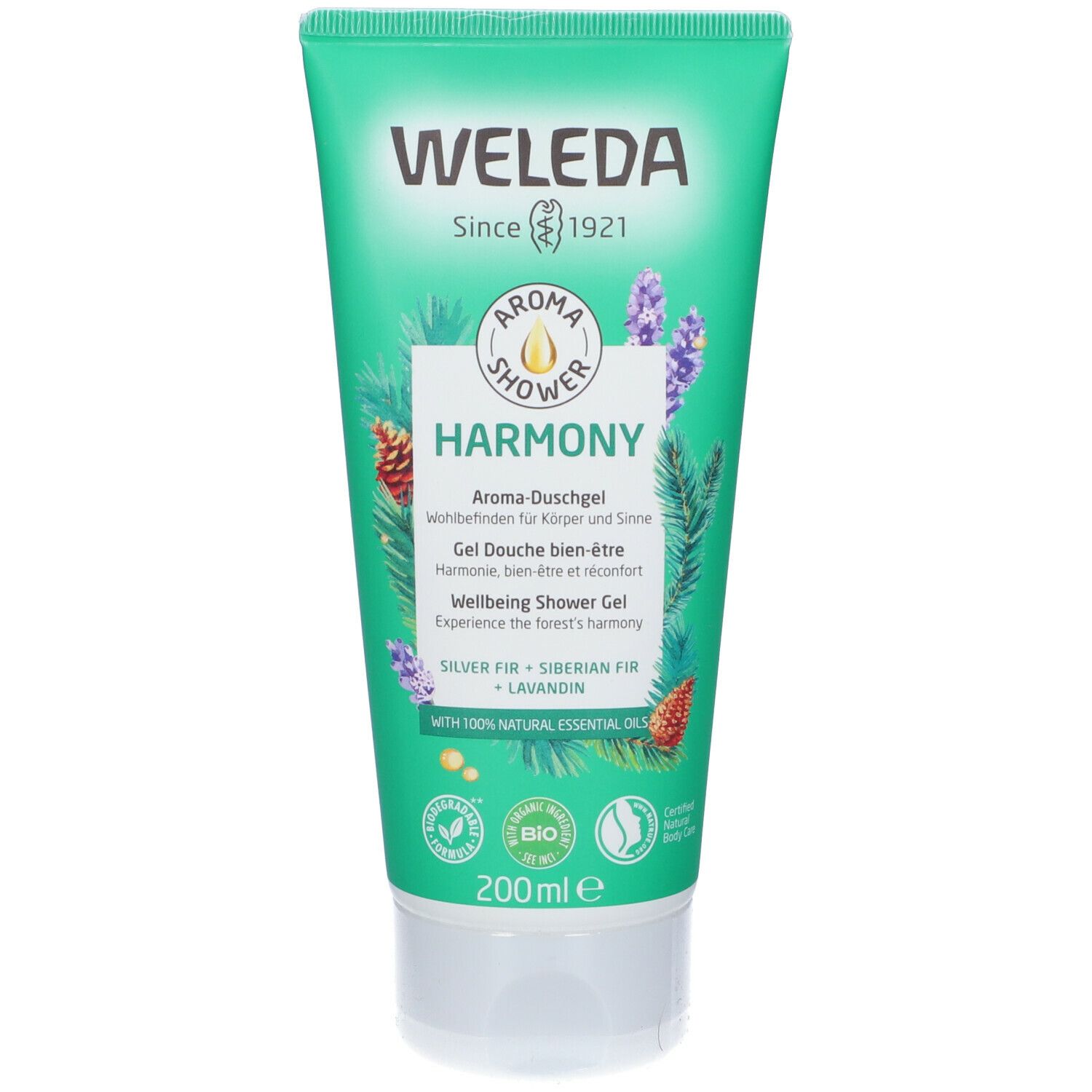 Tubo verde con tappo bianco. Scritta: WELEDA Aroma Shower Harmony. Contiene oli essenziali. Certificazione bio.