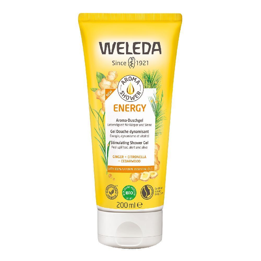 Tubo giallo con tappo bianco. Scritta WELEDA, Aroma Shower Energy. Contiene zenzero, citronella e legno di cedro. Certificazione bio.