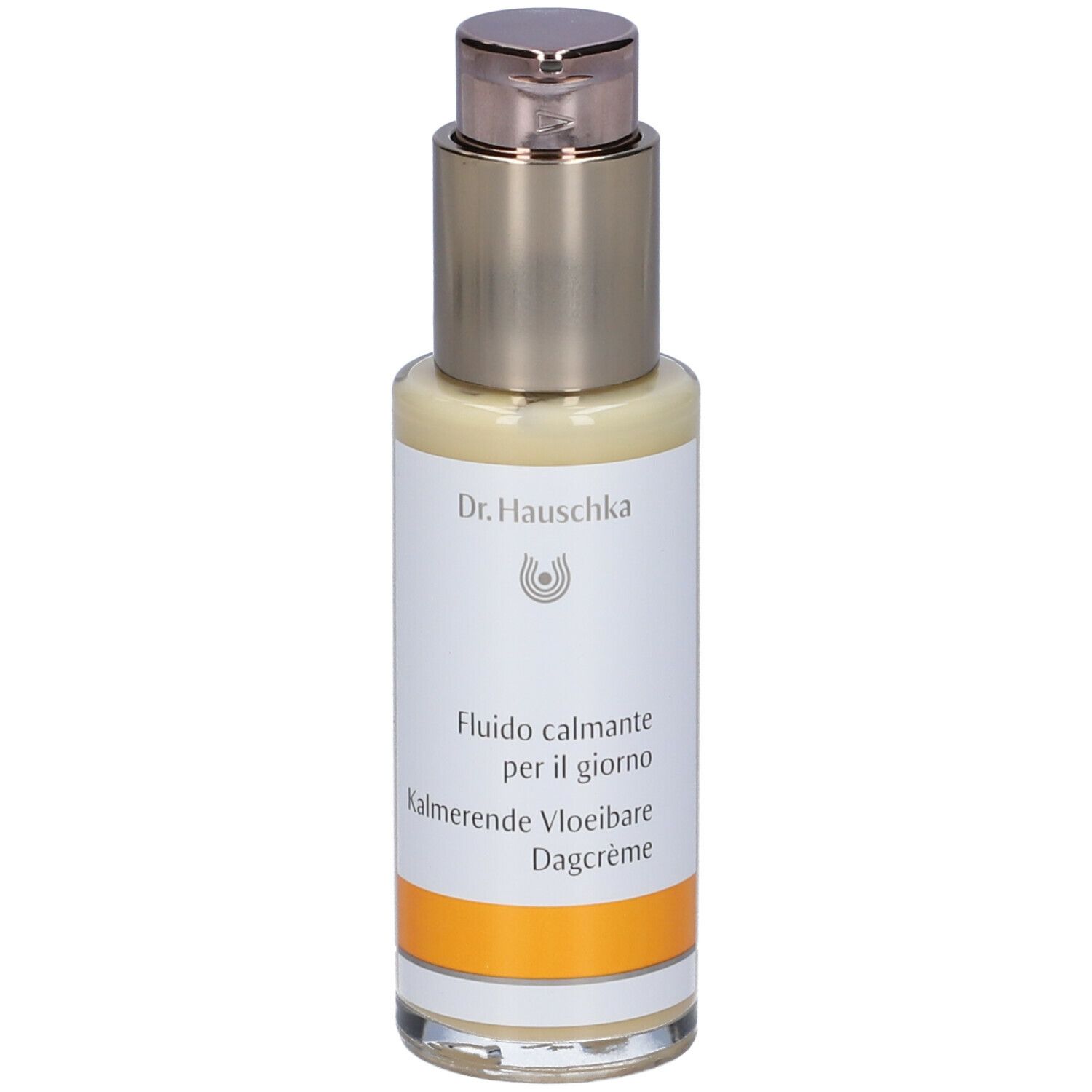 Creme-Flakon mit Dosierpumpe. Aufschrift: Dr. Hauschka, Fludio calmante per il giorno, Kalmerende Vloeibare Dagcrème.