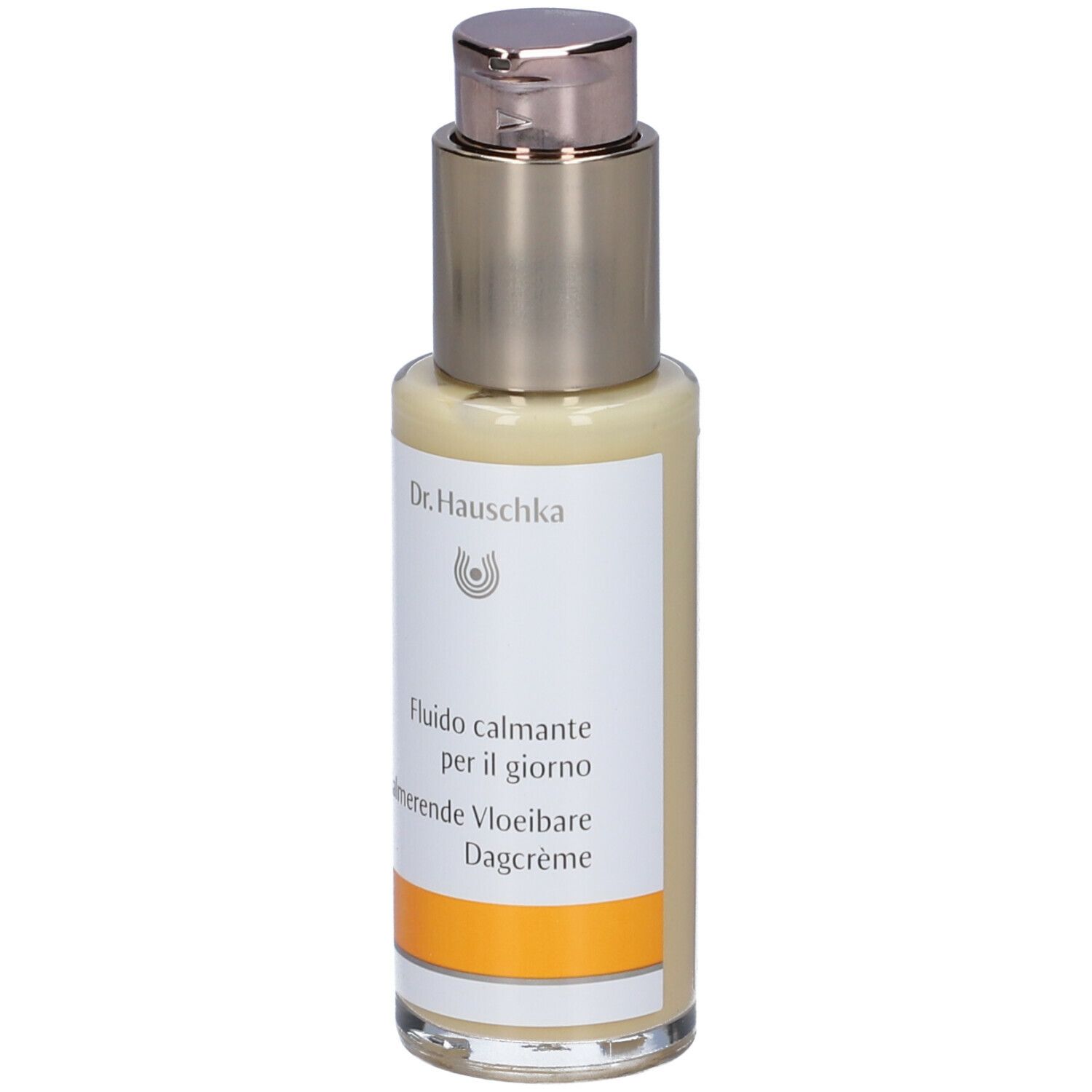 Creme-Flakon mit Dosierpumpe. Aufschrift: Dr. Hauschka, Fludio calmante per il giorno, Kalmerende Vloeibare Dagcrème.