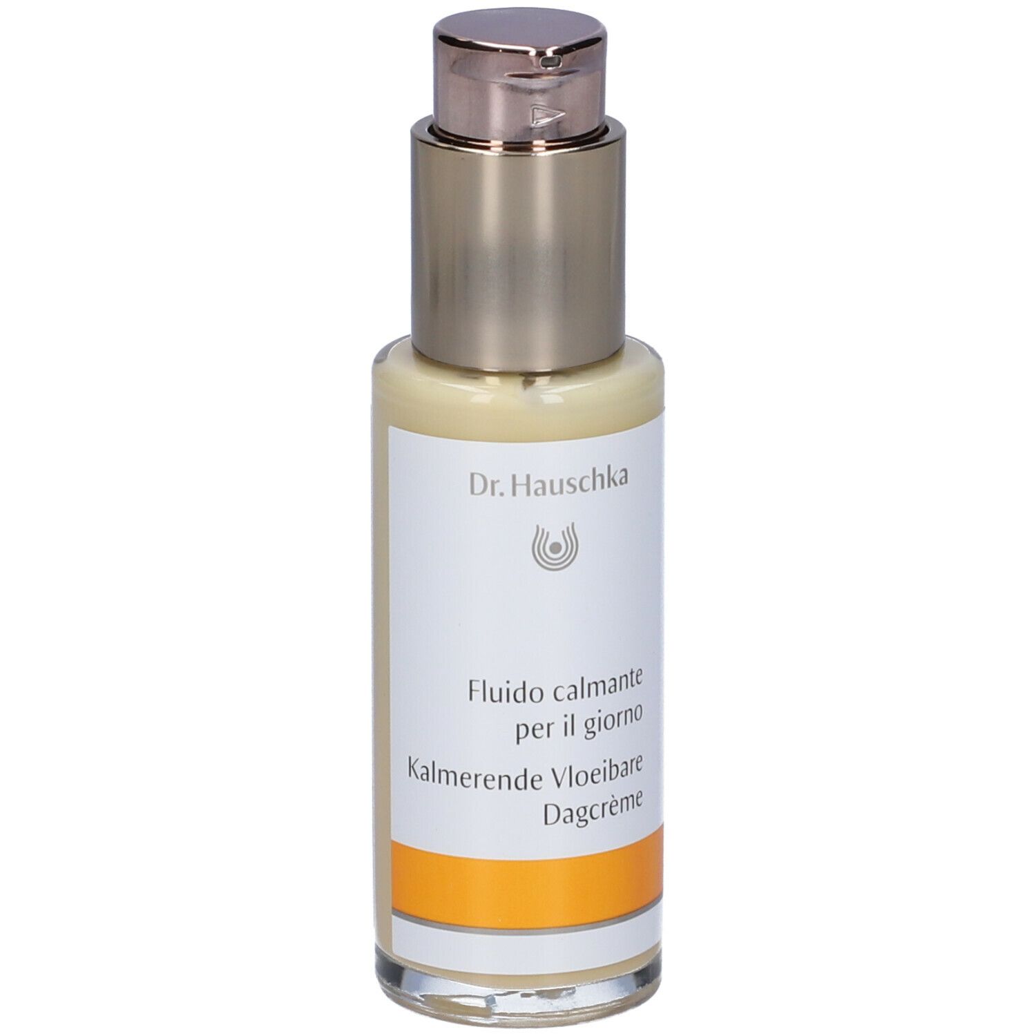 Creme-Flakon mit Dosierpumpe. Aufschrift: Dr. Hauschka, Fludio calmante per il giorno, Kalmerende Vloeibare Dagcrème.