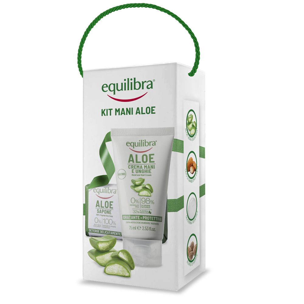 Scatola bianca con manico verde. Contiene crema e sapone. Scritta: Equilibra Kit Mani Aloe.
