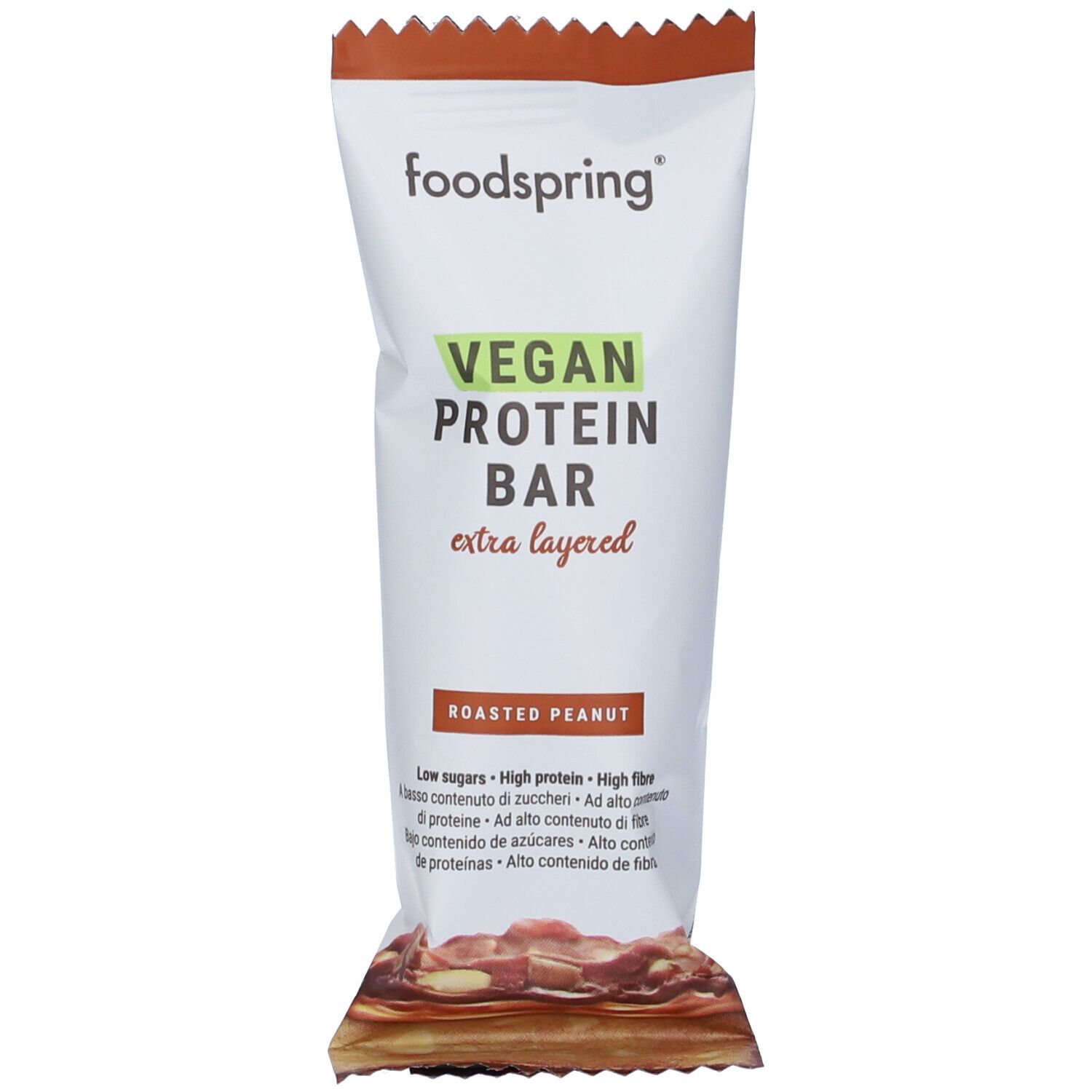 Barretta proteica confezionata con logo "foodspring" e scritta "VEGAN PROTEIN BAR". Scritta "Roasted Peanut".