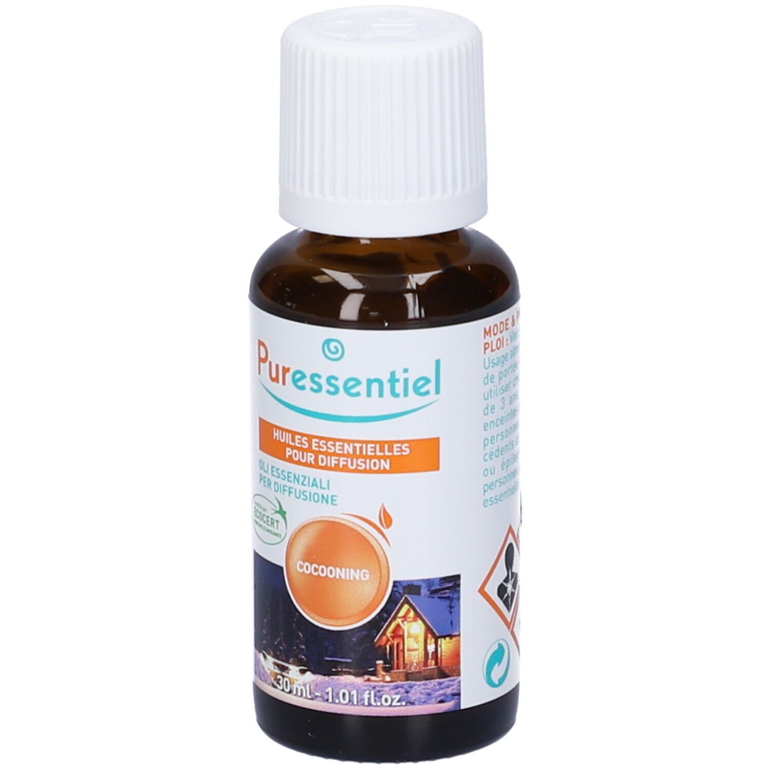 Flacone di vetro marrone, tappo bianco. Etichetta con marchio Puressentiel, nome Cocooning. Certificazione Ecocert.