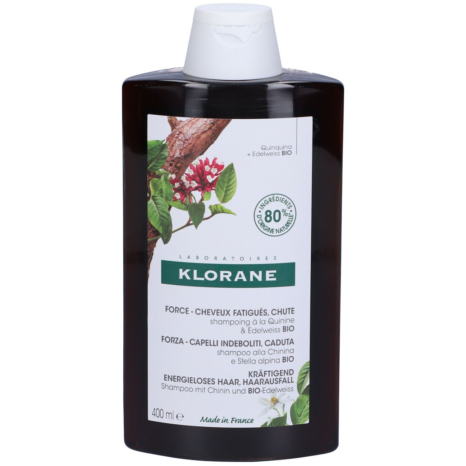 Flacone shampoo Klorane. Marrone, tappo bianco. Etichetta con informazioni e logo.