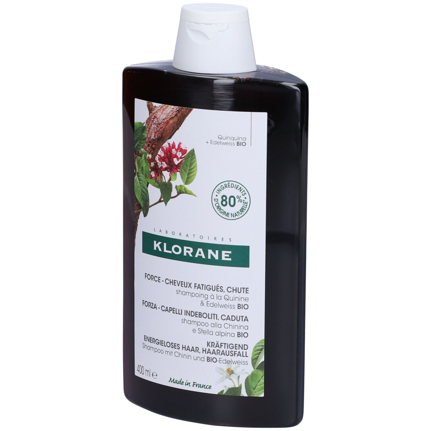 Flacone shampoo Klorane. Marrone, tappo bianco. Etichetta con informazioni e logo.