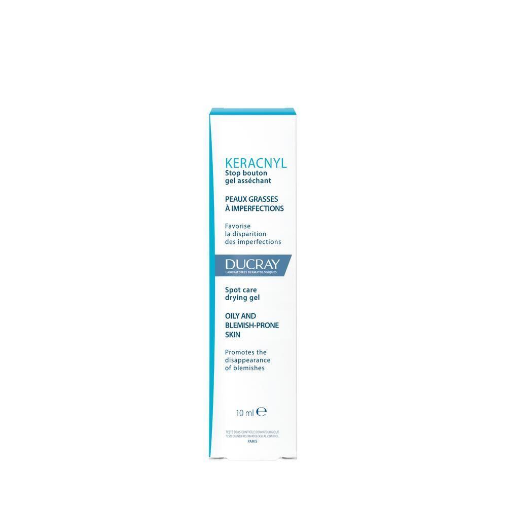 Scatola con testo: KERACNYL, Stop bouton gel asséchant, Ducray, Spot care drying gel, 10ml. Blu e bianco.