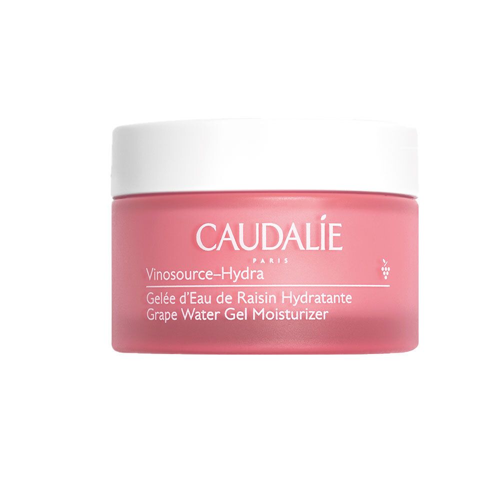 Vaso rosa con coperchio bianco. Scritta: CAUDALIE, Vinosource-Hydra, Gelée d'Eau de Raisin Hydratante, Grape Water Gel Moisturizer.
