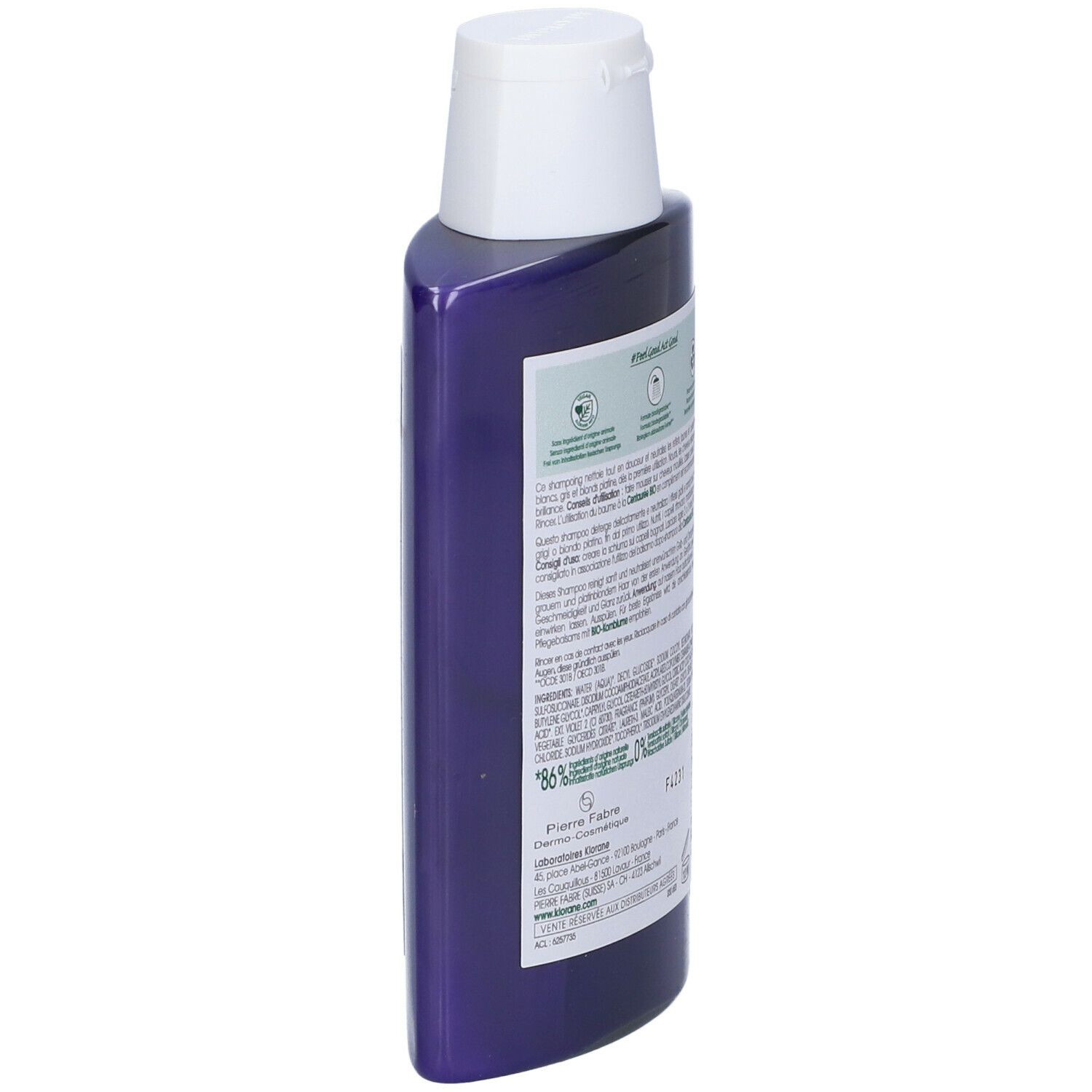 Flacone shampoo KLORANE blu, tappo bianco. Etichetta con fiordaliso, testo: Anti-giallo, 86% ingredienti naturali.