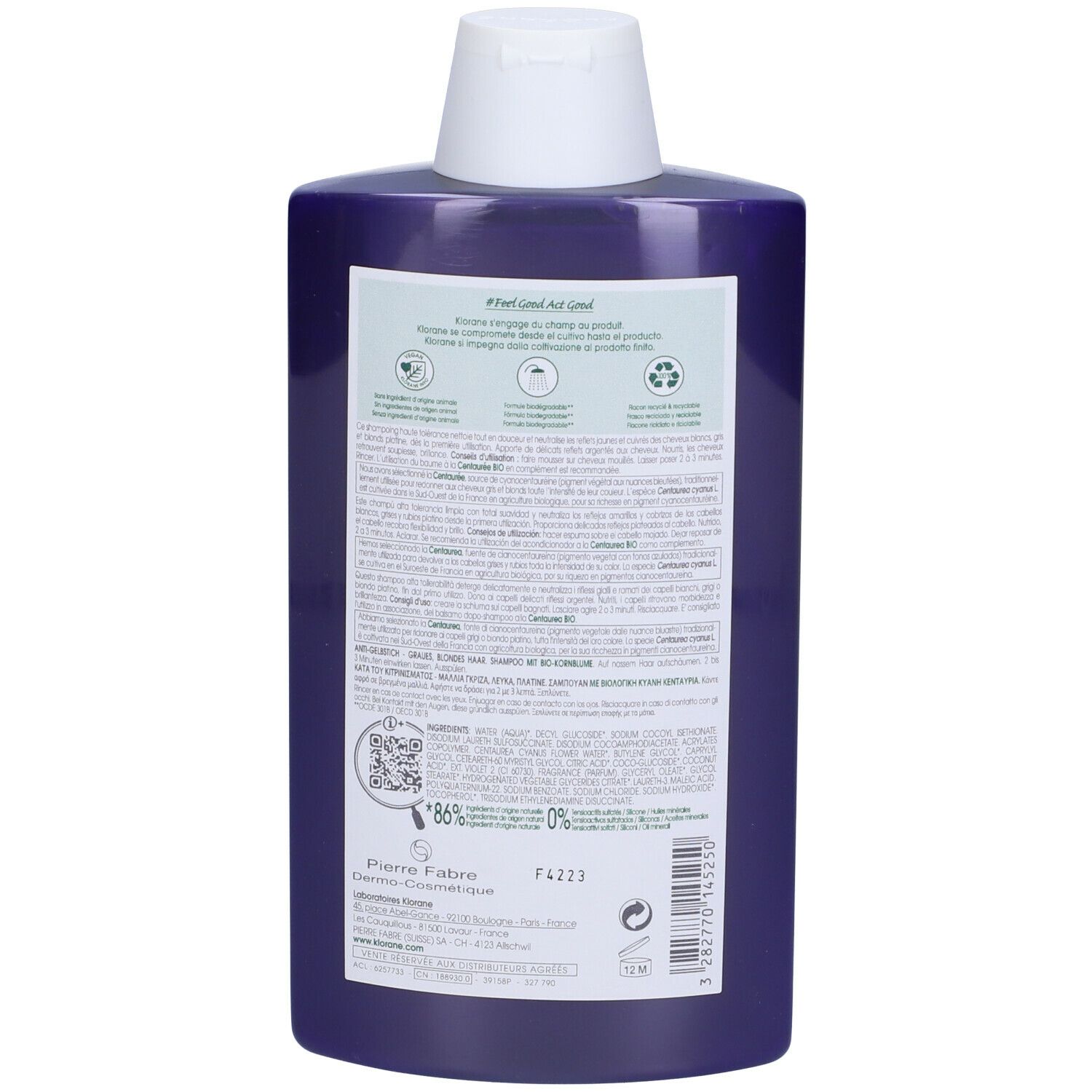 Retro del flacone di shampoo blu. Etichetta con informazioni sul prodotto, codice QR e simboli di riciclaggio.