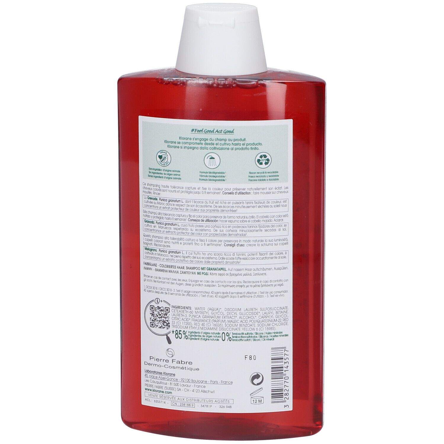 Retro del flacone di shampoo rosso. Testo e codice QR. Informazioni sugli ingredienti e il riciclo.