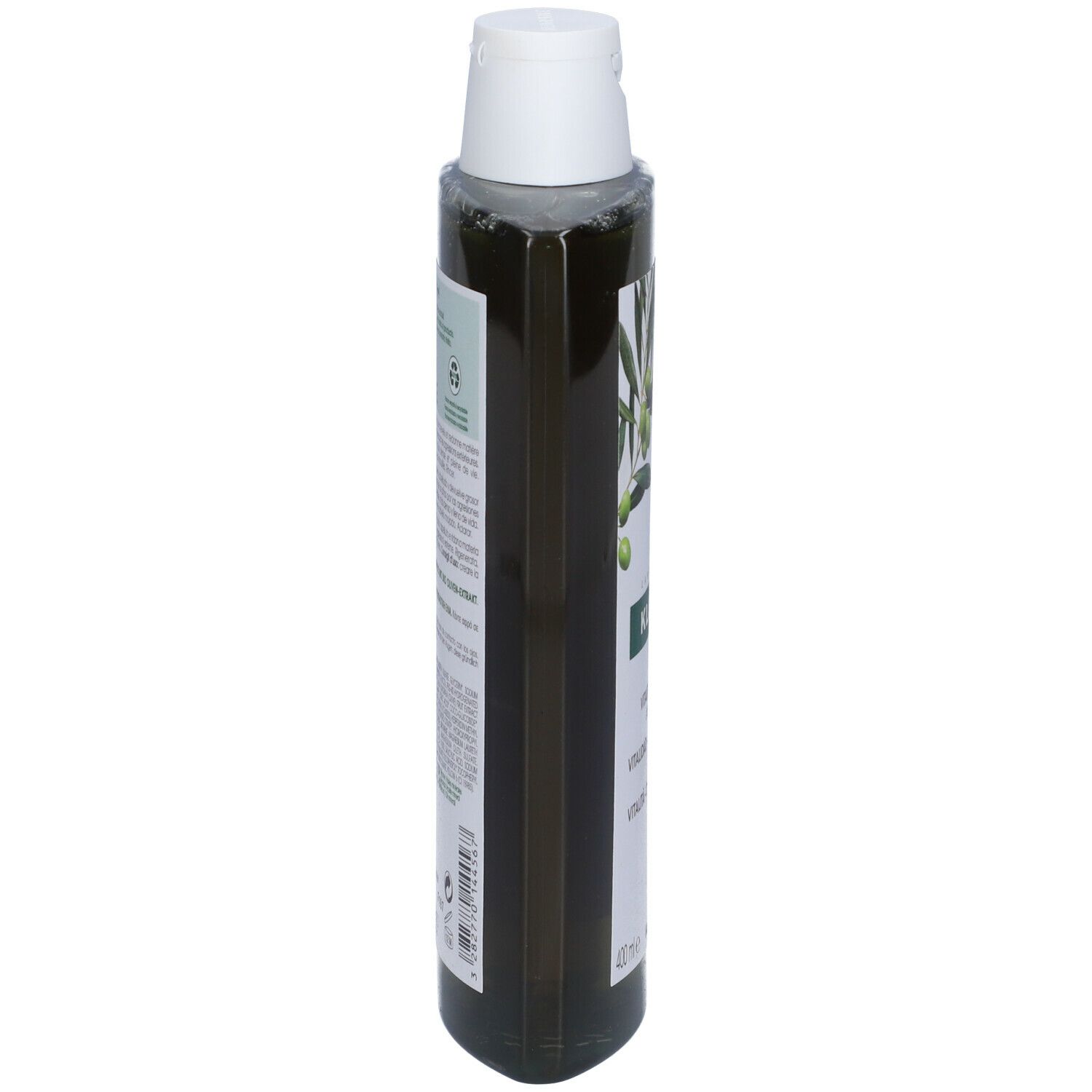Flacone di shampoo verde, vista laterale. Testo e informazioni sul prodotto sull'etichetta.