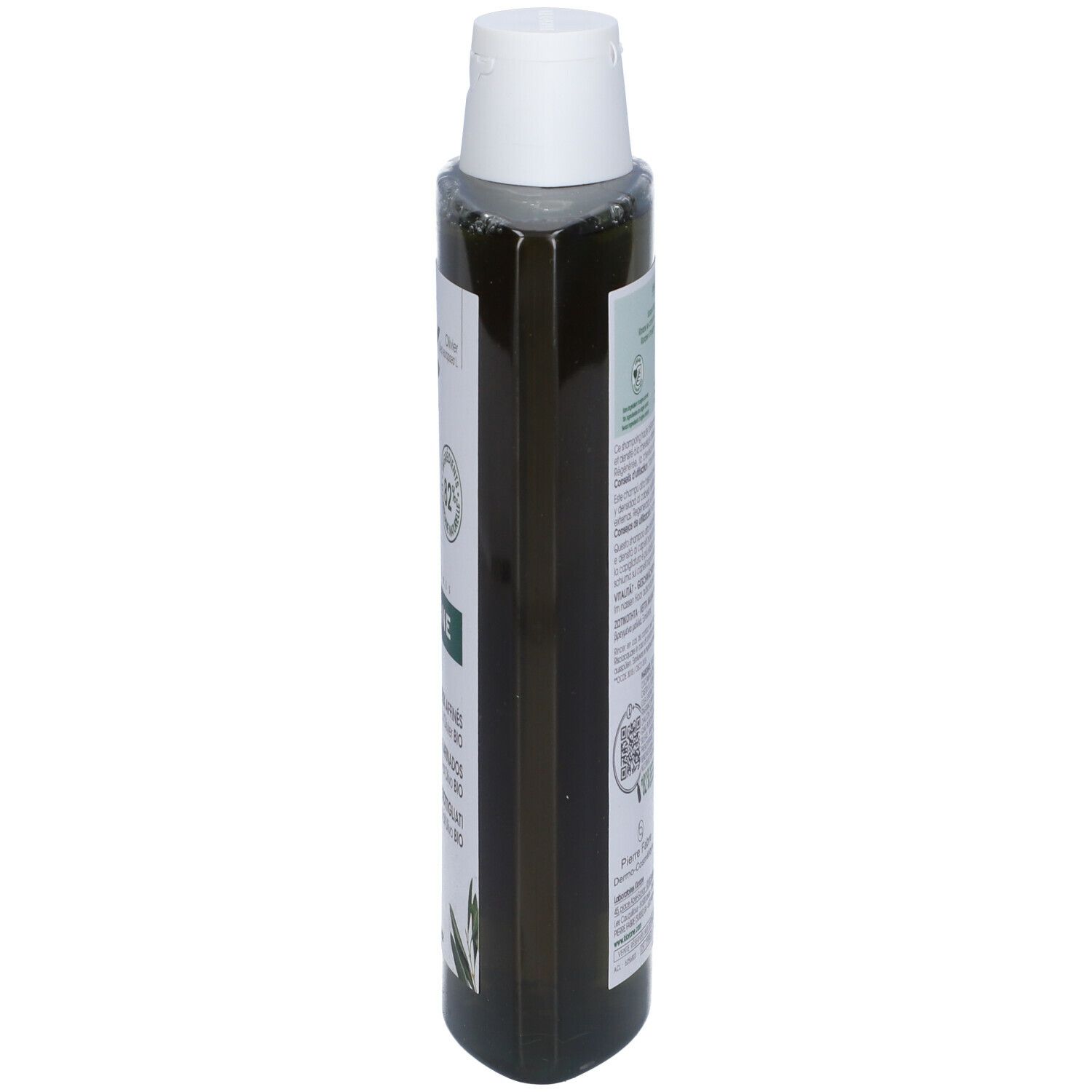 Flacone di shampoo verde, vista laterale. Testo e informazioni sul prodotto sull'etichetta.