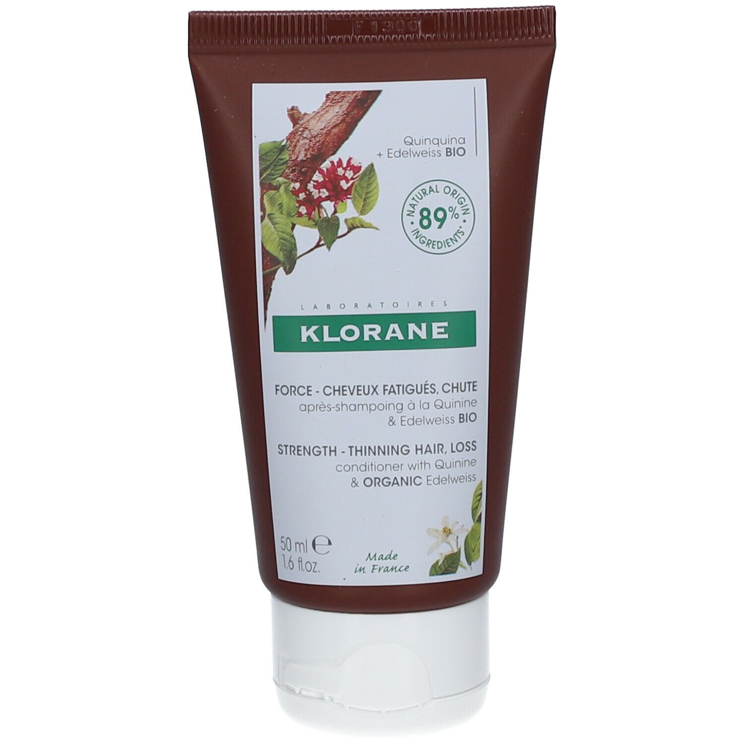 Tubo marrone con tappo bianco. Scritta: KLORANE, illustrazione vegetale, testo. 89% ingredienti di origine naturale.