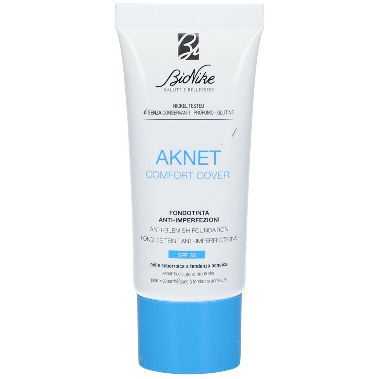 Tubo bianco con tappo blu. Scritta: AKNET Comfort Cover, Anti-imperfezioni, SPF 30. Marchio: BioNike.