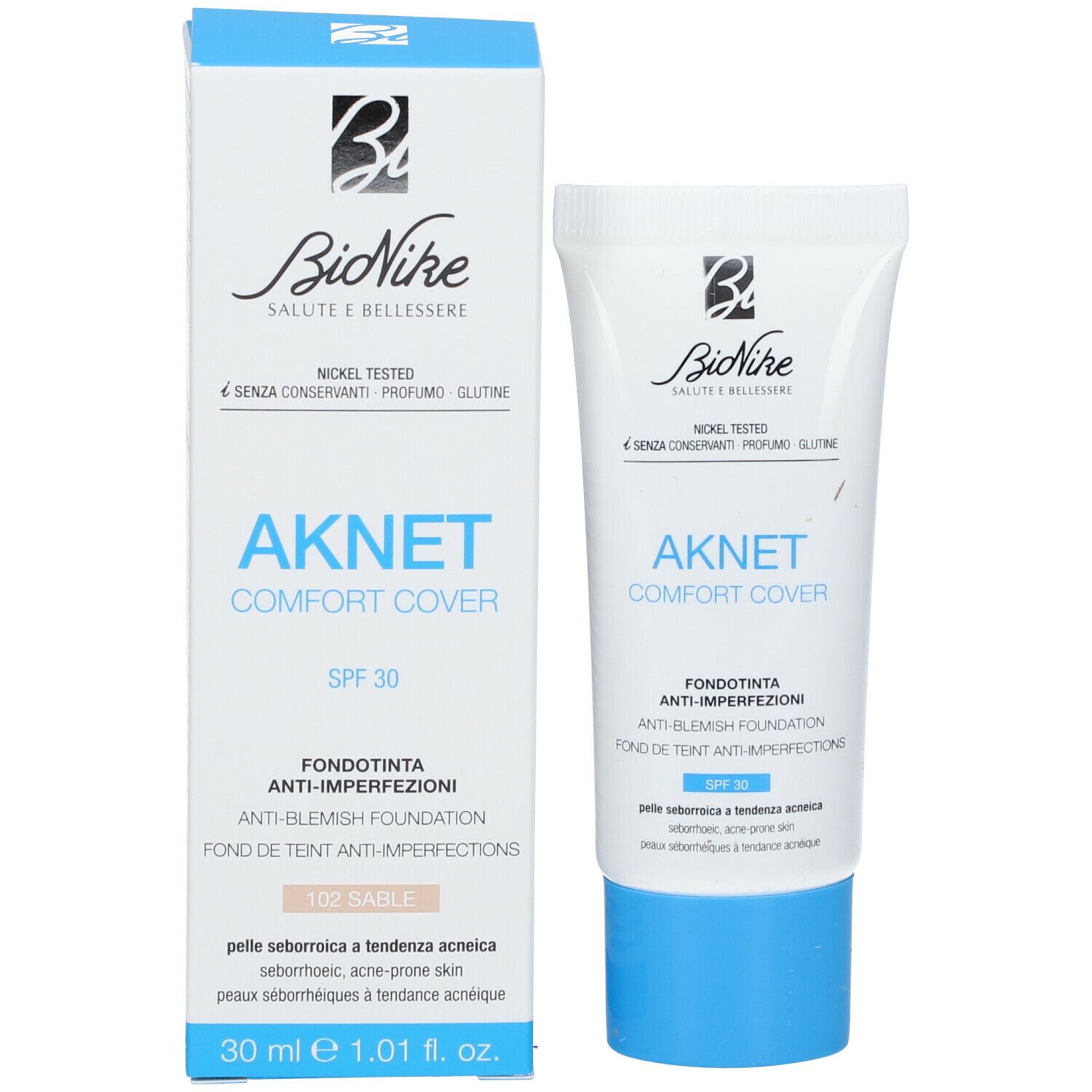 Confezione del prodotto con tubo. Scritta: AKNET Comfort Cover, SPF 30, 102 Sable. Marchio: BioNike. Scatola e tubo.