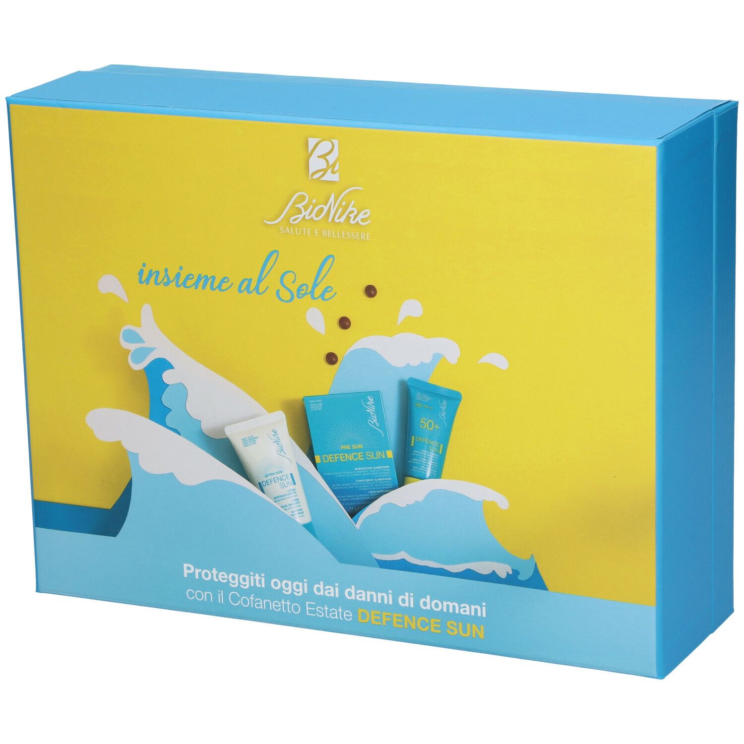 Bionike Travel Kit Speciale Estate. Confezione rettangolare con design giallo e blu. Motivo a onde e immagini dei prodotti.