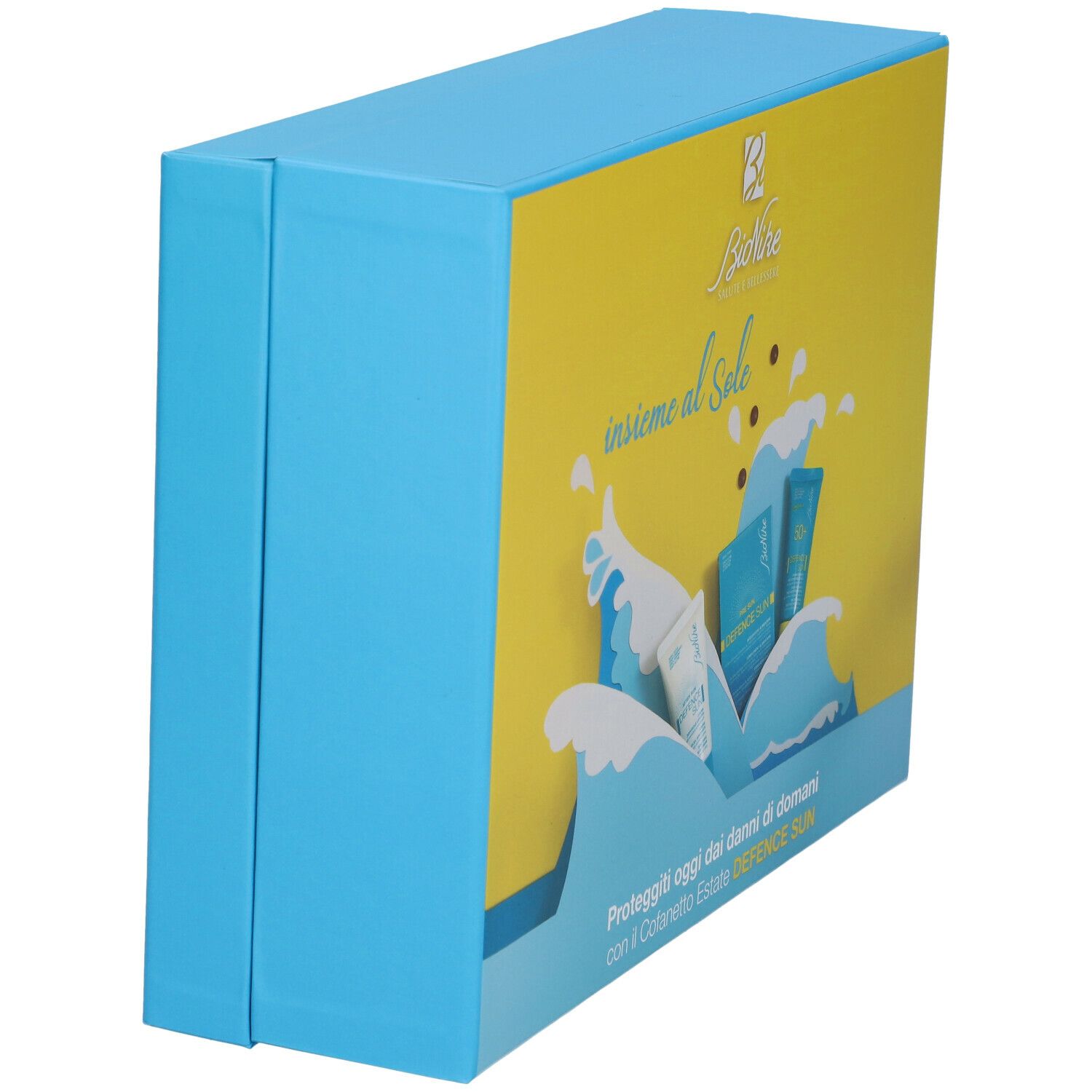 Bionike Travel Kit Speciale Estate. Confezione, vista laterale. Blu e giallo, con immagini dei prodotti e testo.